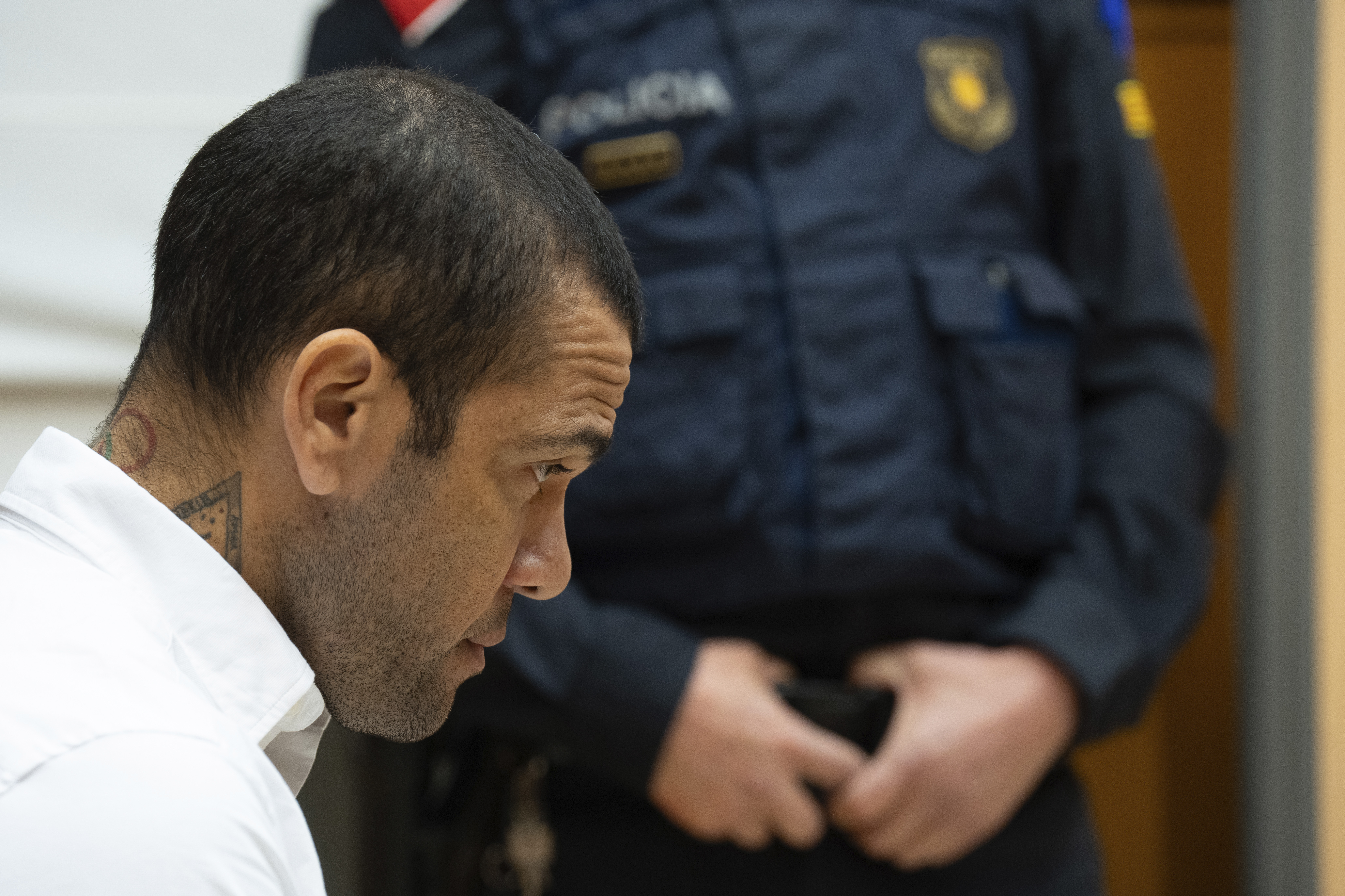 FILE - Brazilian soccer star Dani Alves sits during his trial in Barcelona, Spain, Monday, Feb. 5, 2024. A Spanish court has decided to release Brazilian soccer star Dani Alves if he pays a bail of one million euros and hands over his passports while awaiting the appeal of his conviction for raping a woman in Barcelona. 