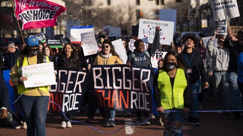 People march through downtown Amarillo to protest a lawsuit to ban the abortion drug mifepristone, Feb. 11, 2023, in Amarillo, Texas. The Supreme Court will again wade into the fractious issue of abortion when it hears arguments Tuesday over mifepristone.