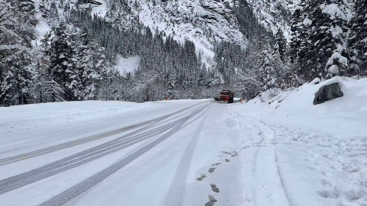 A snowplow works to clear Little Cottonwood Canyon Monday afternoon after multiple crashes were reported, forcing the Utah Department of Transportation to close the canyon highway for nearly two hours.