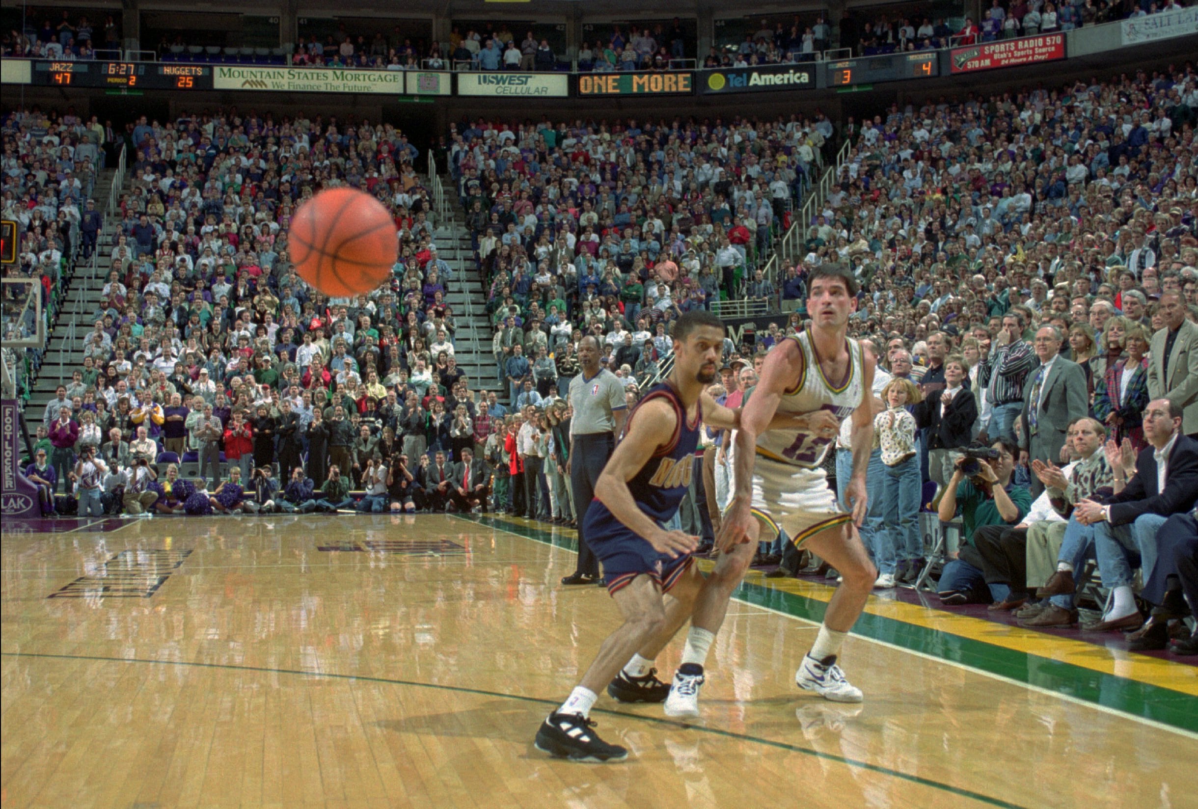 John Stockton passes the ball around Denver’s Mahmoud Abdul-Rauf for his record-breaking 9,922nd NBA assist on Feb. 1, 1995. He is the all-time NBA assists leader with 15,806.