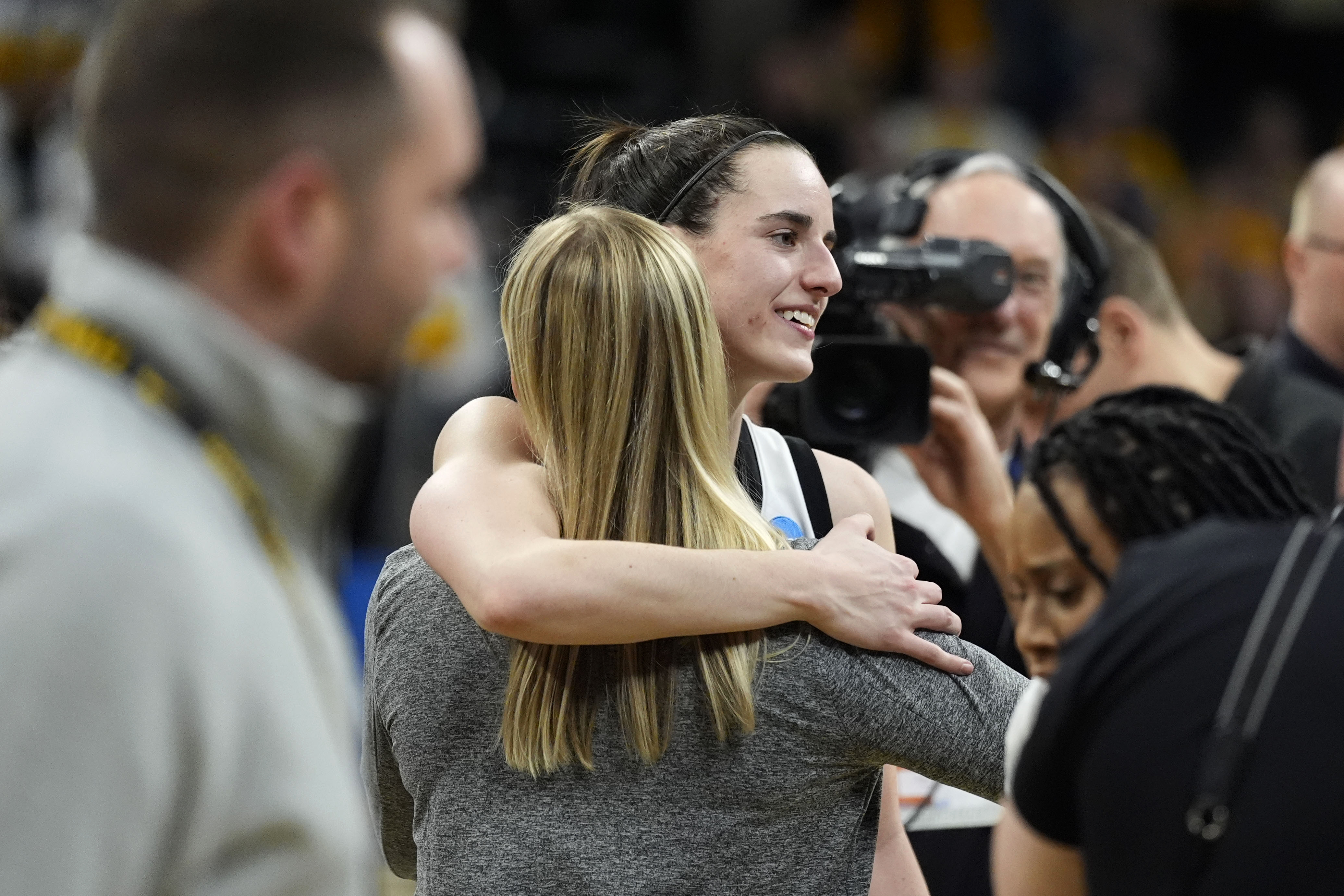 Iowa guard Caitlin Clark celebrates with teammates after a second-round college basketball game against West Virginia in the NCAA Tournament, Monday, March 25, 2024, in Iowa City, Iowa. Iowa won 64-54. 