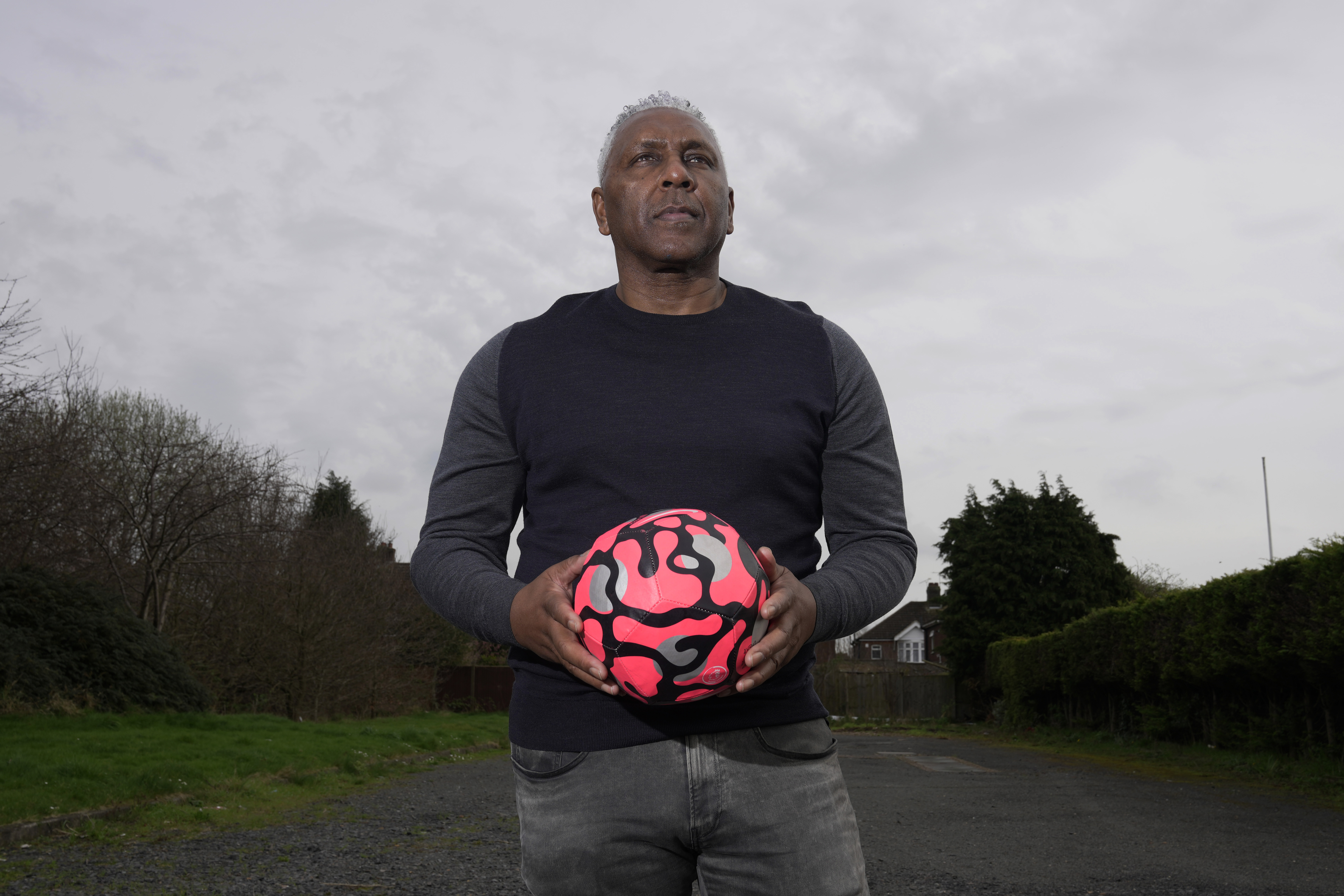 Former England international soccer player Ricky Hill poses for a photograph in Luton, England, Wednesday, March 20, 2024. Racism has long permeated the world’s most popular sport, with soccer players subjected to racist chants and taunts online. While governing bodies like FIFA and UEFA have taken steps to combat the abuse of players, the lack of diversity in the upper ranks at major clubs remains an unsolved problem. Hill has just left the U.K. to take a management position with a suburban Chicago soccer club.