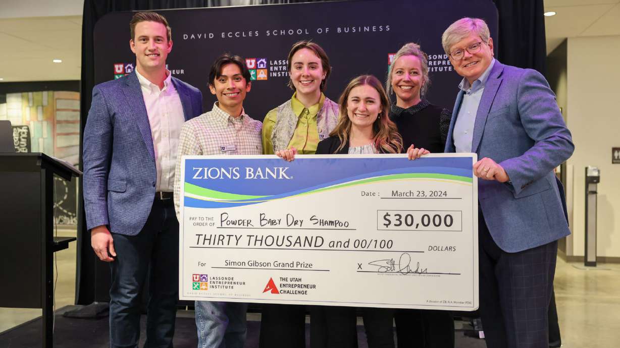 The Powder Baby Dry Shampoo team poses with its check after winning the 2024 Utah Entrepreneur Challenge. The BYU startup took home a $30,000 prize over the weekend, en route to a first-place finish in the Utah Entrepreneur Challenge.