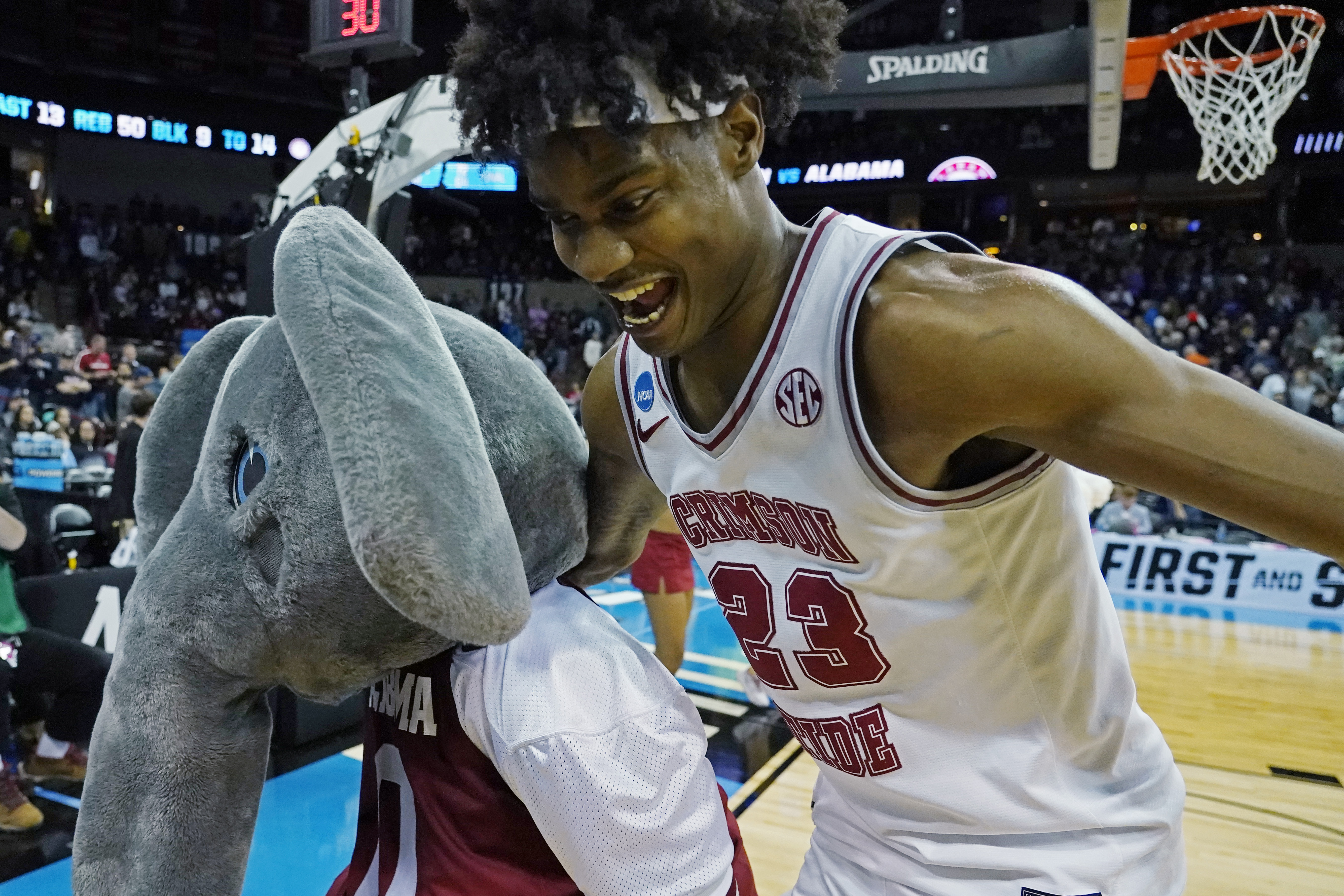Alabama forward Nick Pringle (23) celebrates with the mascot after Alabama beat Grand Canyon in a second-round college basketball game in the NCAA Tournament in Spokane, Wash., Sunday, March 24, 2024. 