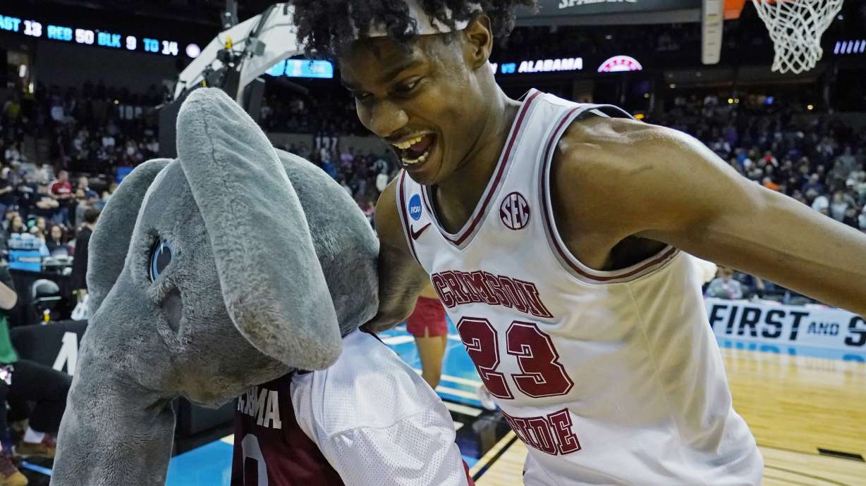 Alabama forward Nick Pringle (23) celebrates with the mascot after Alabama beat Grand Canyon in a second-round college basketball game in the NCAA Tournament in Spokane, Wash., Sunday, March 24, 2024.