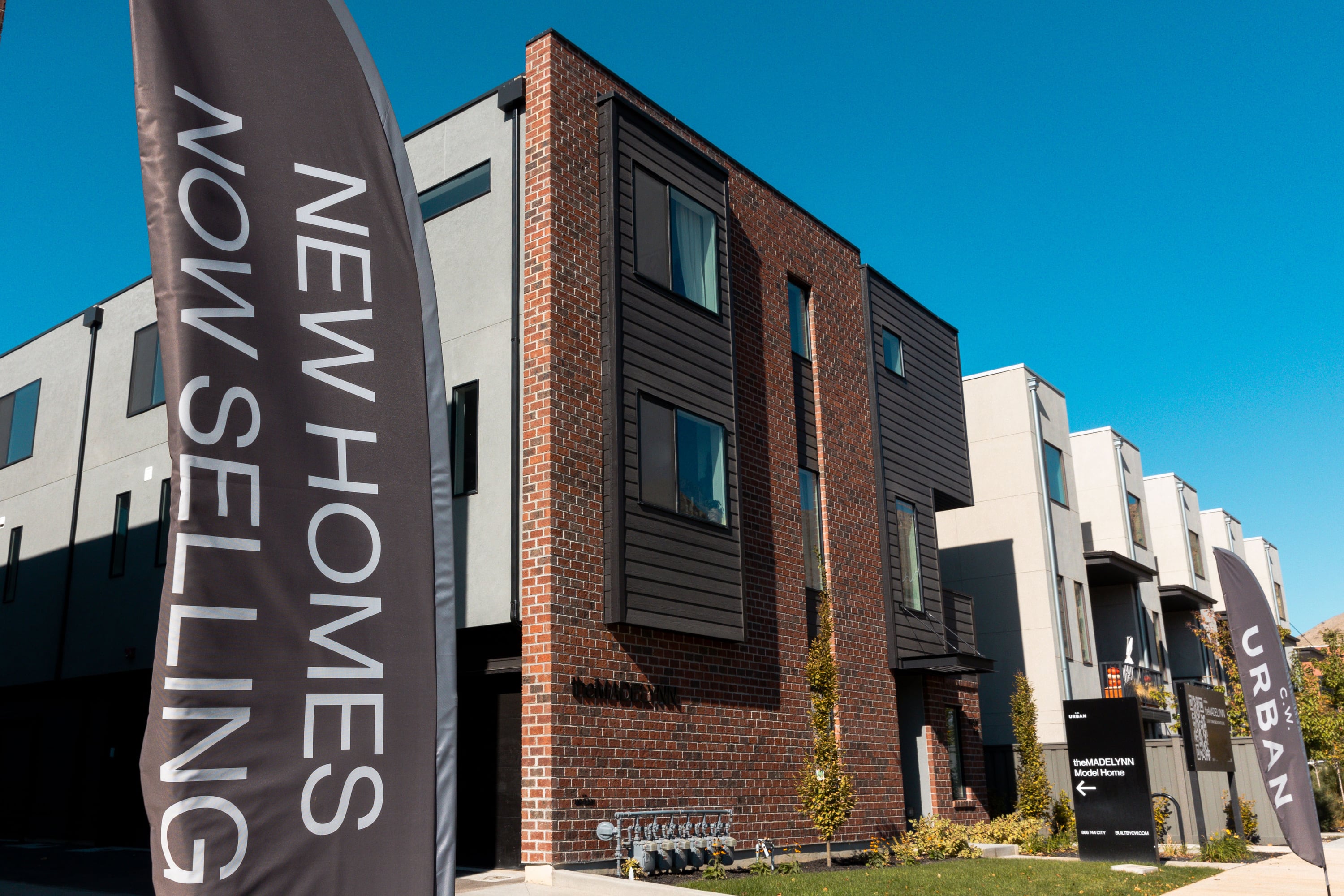 A sign in front of town houses for sale in Salt Lake City on Oct. 30, 2023. Experts question if the dramatic change in real estate commissions will help make the market more manageable for buyers.