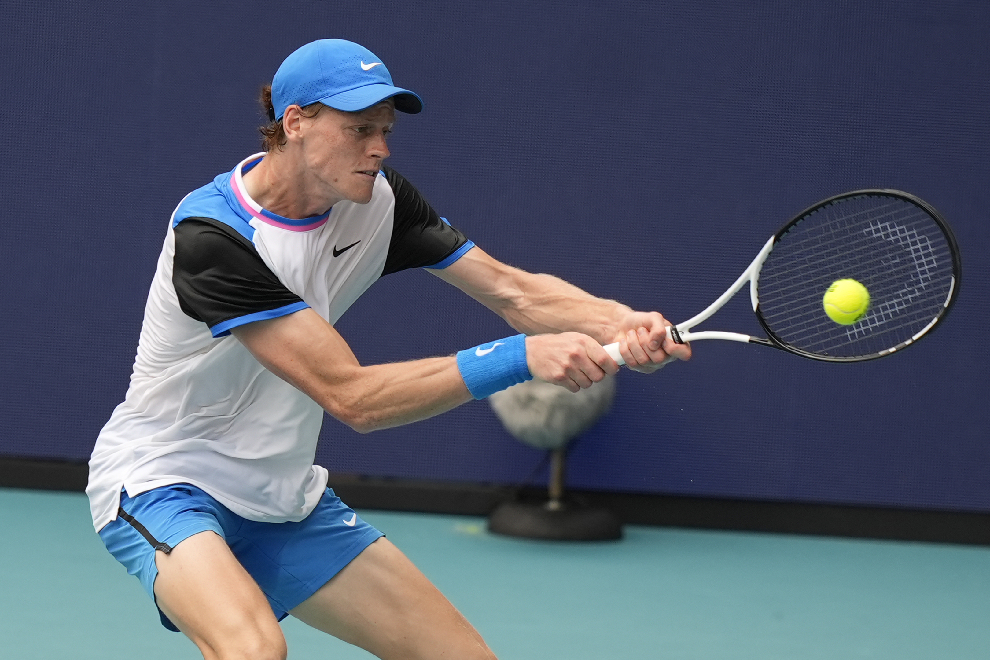 Jannik Sinner, of Italy, hits a return to Tomas Machac, of the Czech Republic, during the Miami Open tennis tournament, Wednesday, March 27, 2024, in Miami Gardens, Fla.