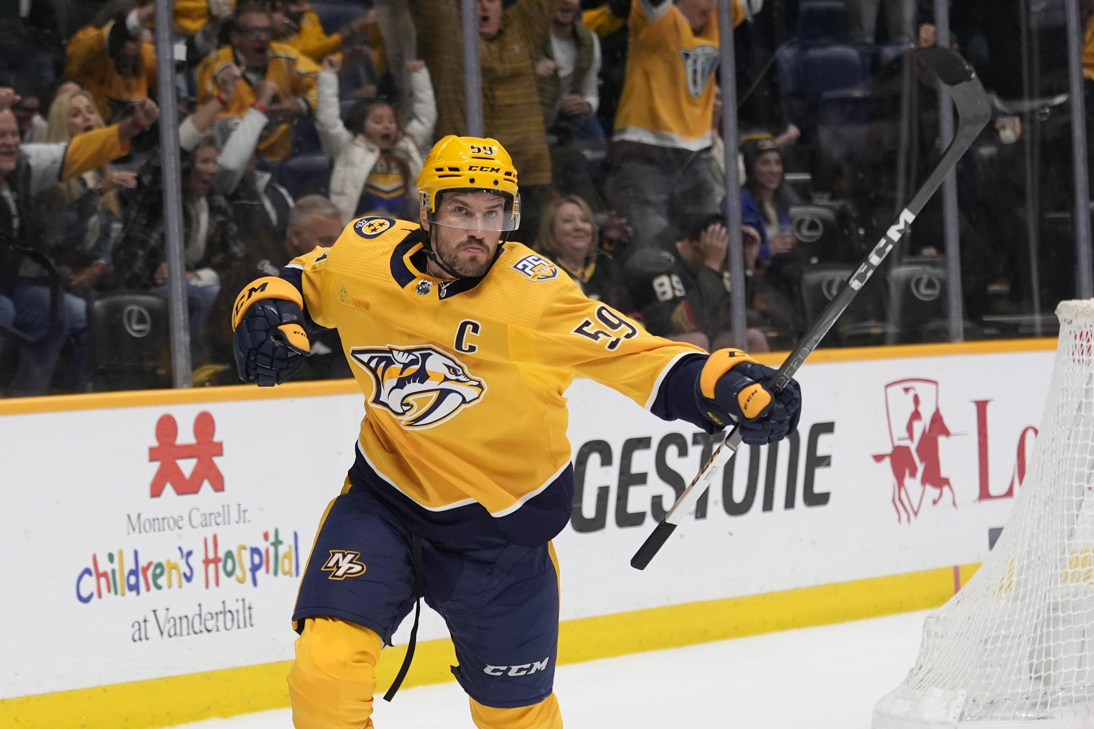 Nashville Predators defenseman Roman Josi (59) celebrates his game winning goal at the end of overtime of an NHL hockey game against the Vegas Golden Knights, Tuesday, March 26, 2024, in Nashville, Tenn. The Predators won 5-4.