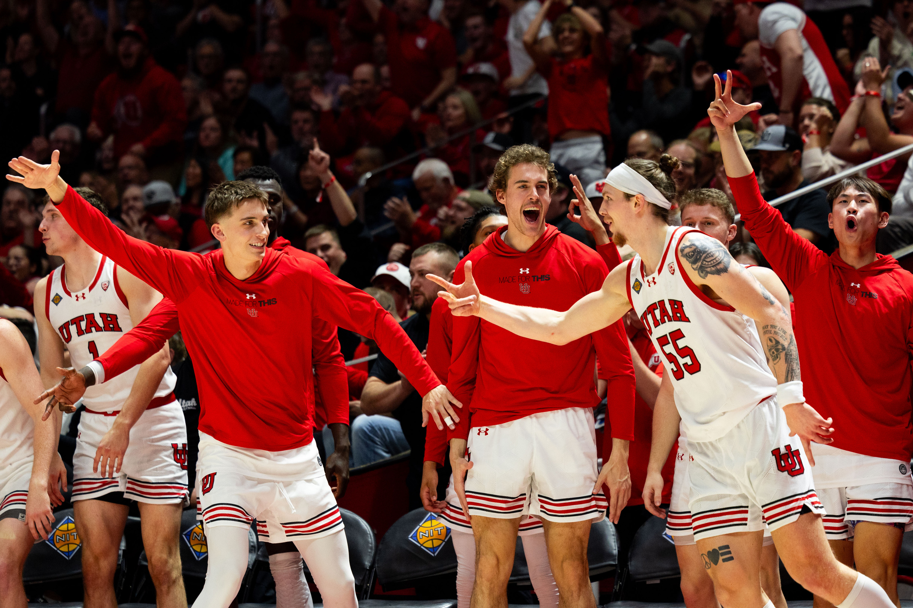 Utah Utes players cheer on Utah Utes guard Gabe Madsen (55) after a 3-point basket during the NIT quarterfinal game between the Utah Utes and the Virginia Commonwealth Rams at the Jon M. Huntsman Center in Salt Lake City on Wednesday, March 27, 2024.