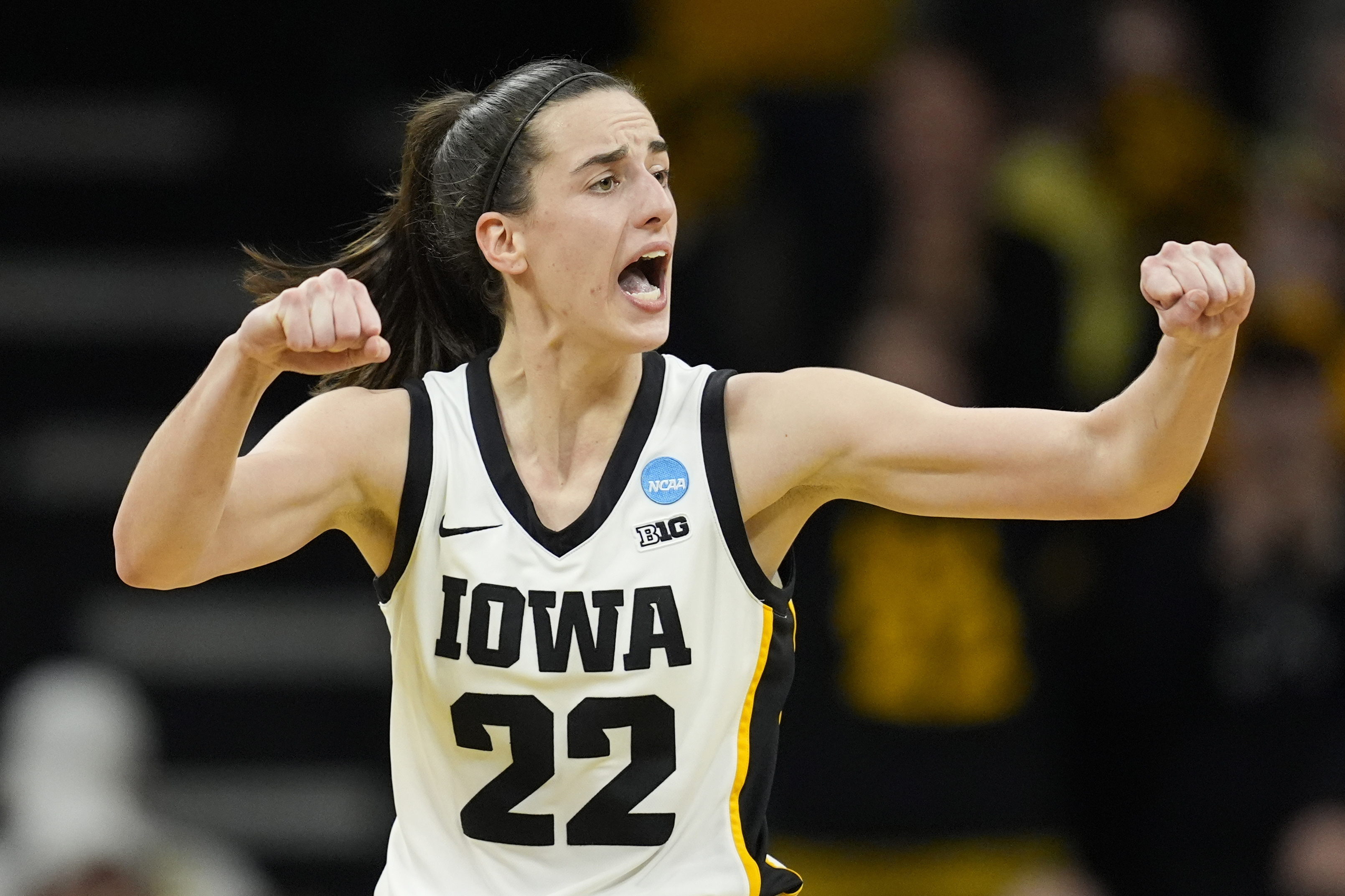 FILE - Iowa guard Caitlin Clark reacts during a second-round college basketball game against West Virginia in the NCAA Tournament, Monday, March 25, 2024, in Iowa City, Iowa. As Clark has become the face of women's basketball, her face is everywhere. She has lucrative NIL deals with Nike, Gatorade, Buick and was featured in a State Farm commercial with Jimmy Butler and Reggie Miller.