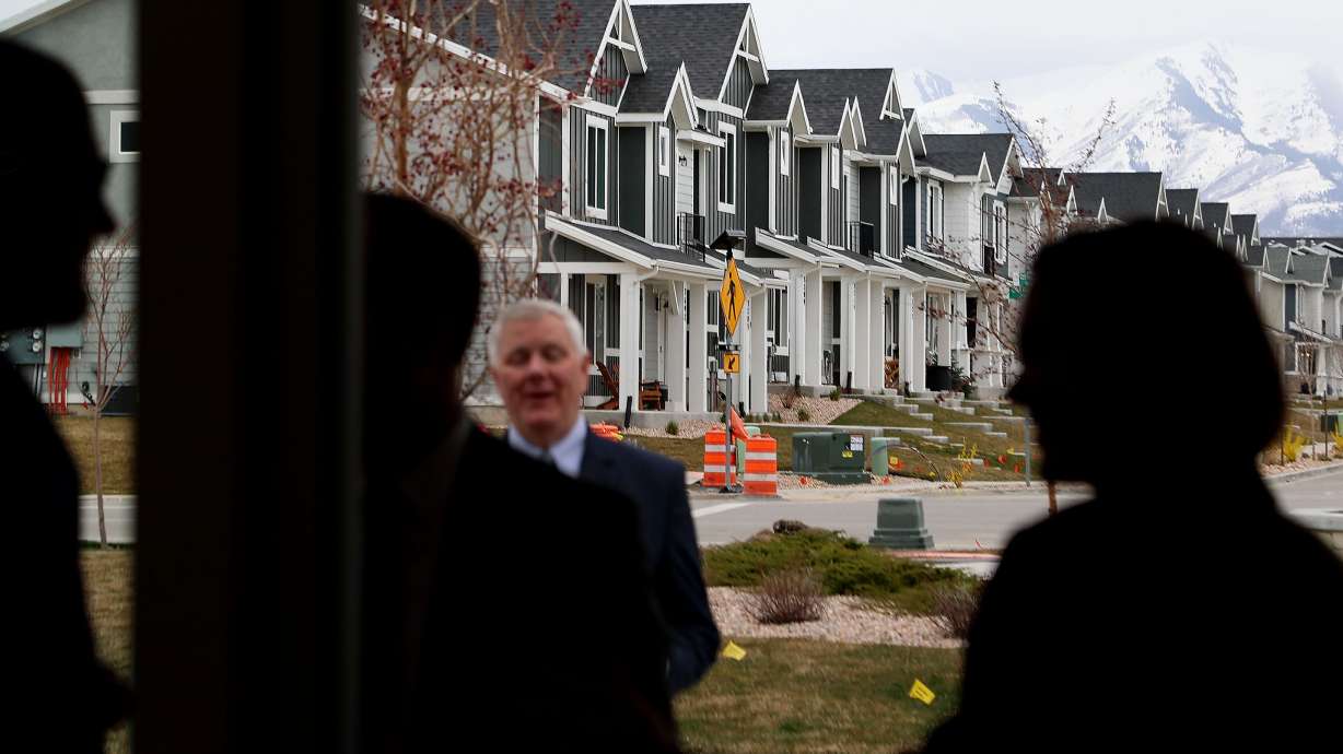 People chat following a ceremonial bill signing with Gov. Spencer Cox that highlighted legislation focused on housing and growth at Cold Spring Ranch, a new home community, in Lehi on Thursday.