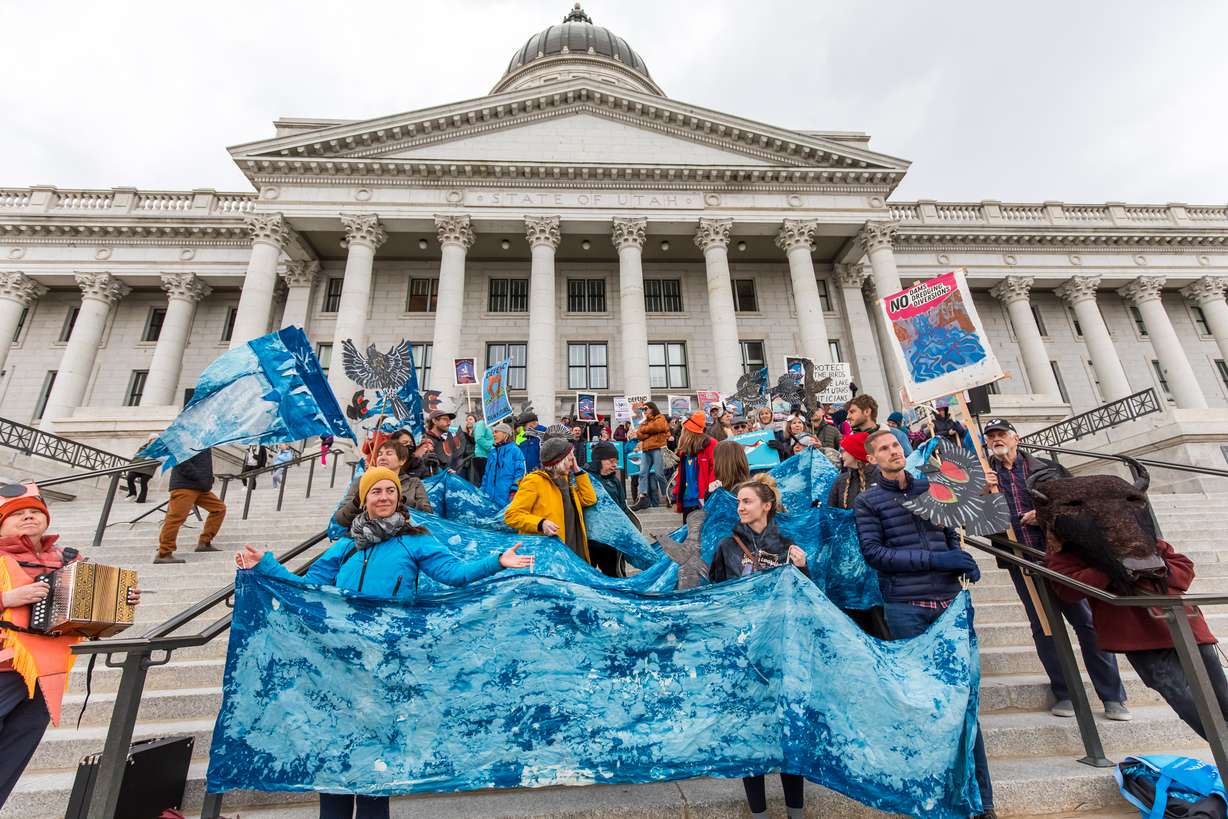 People dress up as different Great Salt Lake creatures and hold signs in support of the lake during a rally celebrating new efforts to protect the Wilson's phalarope at the Utah Capitol on Thursday.
