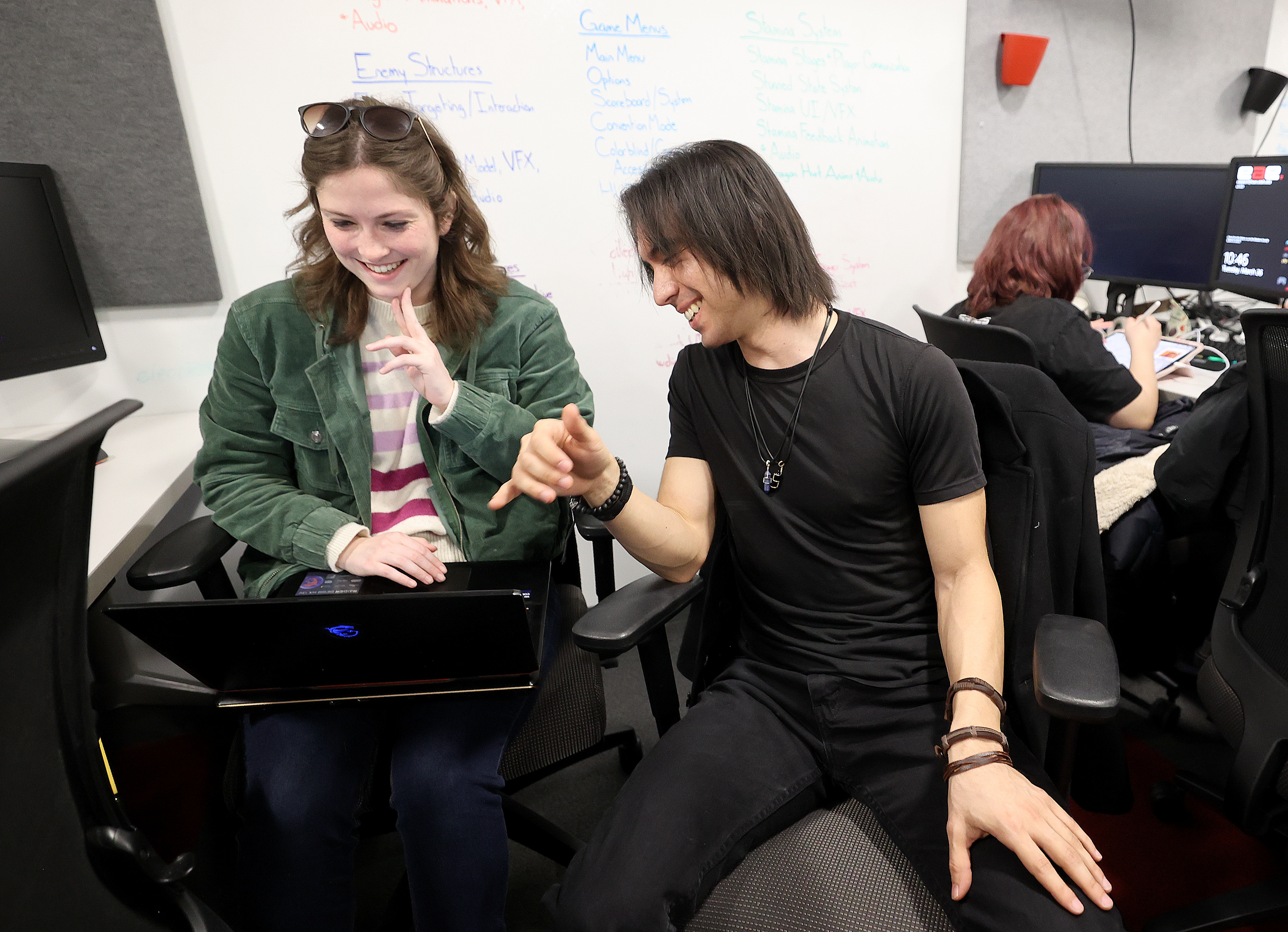 Masters of Entertainment Arts and Engineering graduate students Sarah Homer and Andrew Lozano work on an alt controller game called Plushie Blaze in Building 72, the former law library, at the University of Utah in Salt Lake City on Tuesday.