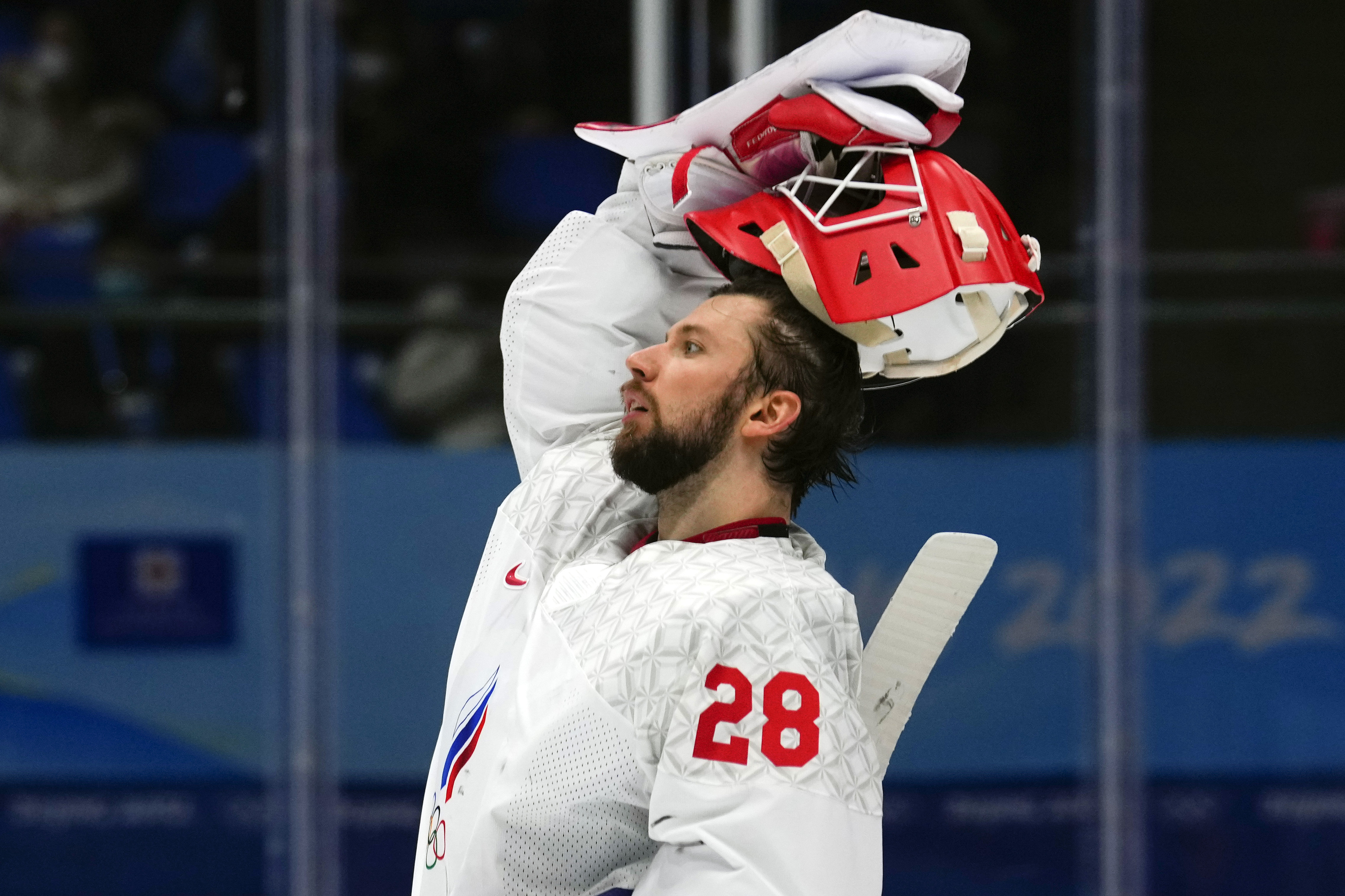 FILE - Russian Olympic Committee goalkeeper Ivan Fedotov (28) reacts after a goal by Finland's Hannes Bjorninen during the men's gold medal hockey game at the 2022 Winter Olympics, Sunday, Feb. 20, 2022, in Beijing. Fedotov has had his contract in Russia's KHL terminated by CSKA Moscow, the team announced Thursday, March 28, 2024, with one year remaining on it. The Philadelphia Flyers own Fedotov's NHL rights, signed him in May 2022 and attempted to bring him to North America a few months later. He was instead taken to a remote military base in the Arctic Circle for a year of service.