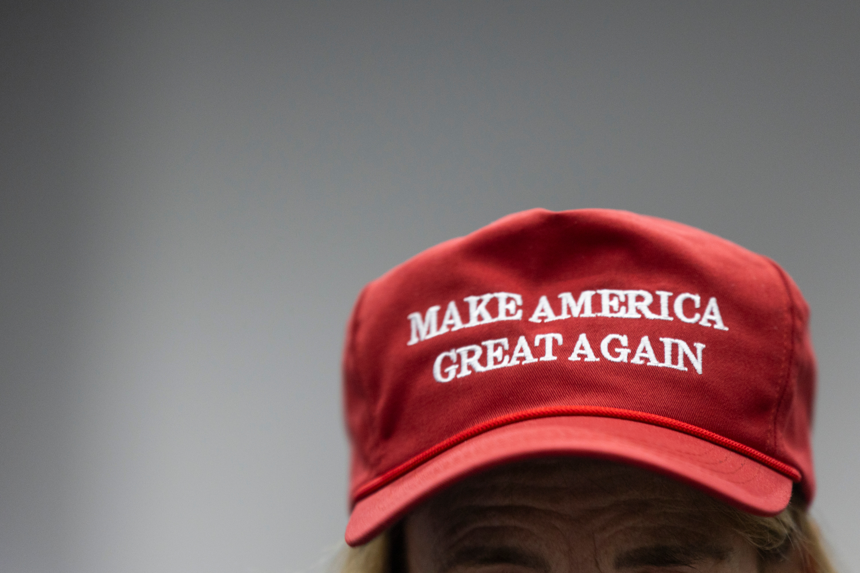 Betsy Barker wears a MAGA hat as Florida Rep. Matt Gaetz endorses Riverton Mayor Trent Staggs in his U.S. Senate run Thursday.