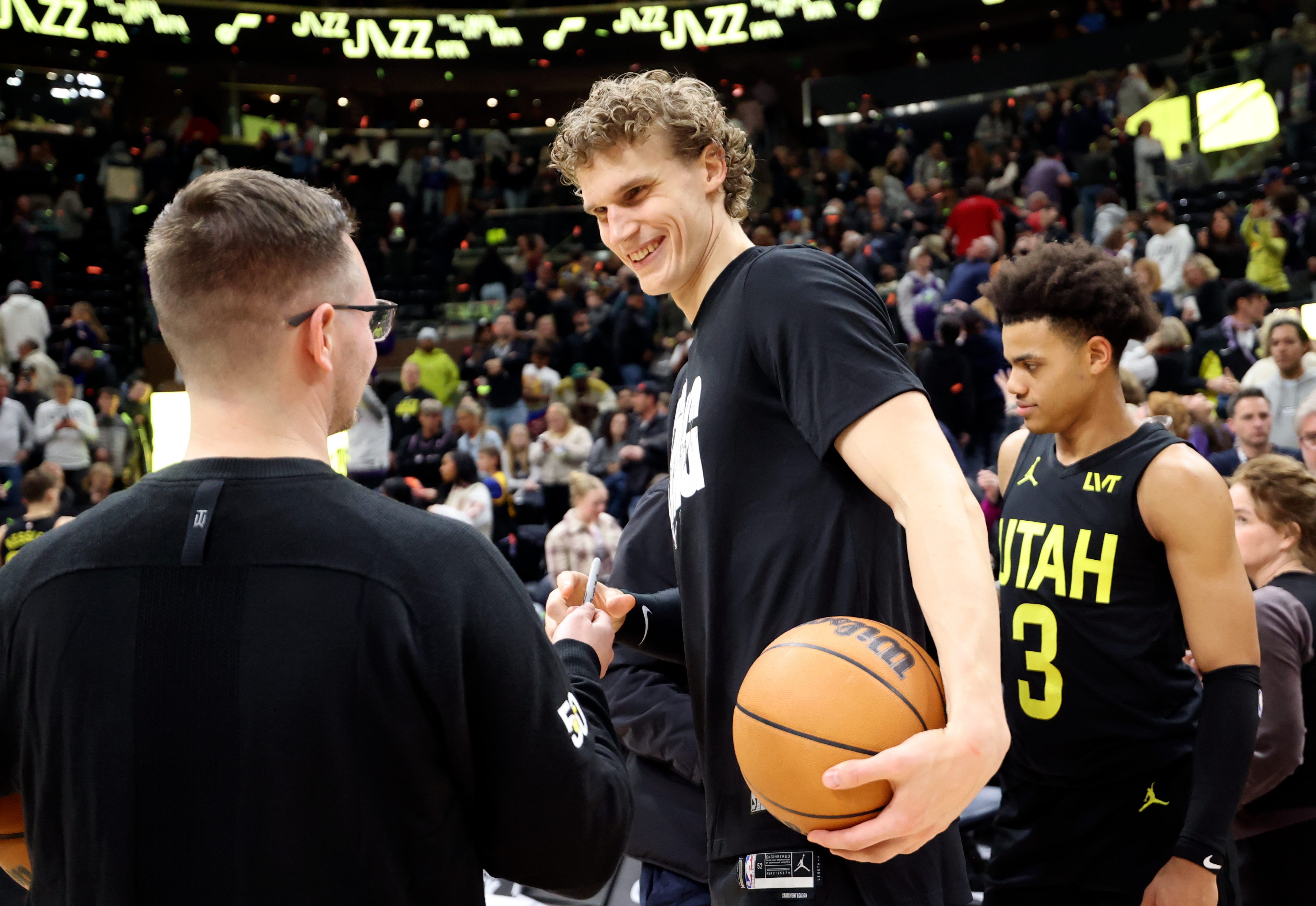 Utah Jazz forward Lauri Markkanen (23) signs an autograph after the Jazz beat the Indiana Pacers in an NBA game at the Delta Center in Salt Lake City on Monday, Jan. 15, 2024. The Jazz won 132-105.