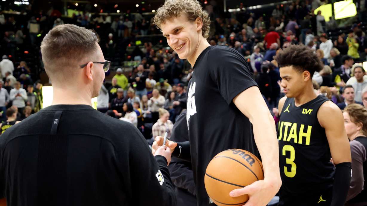 Utah Jazz forward Lauri Markkanen (23) signs an autograph after the Jazz beat the Indiana Pacers in an NBA game at the Delta Center in Salt Lake City on Monday, Jan. 15, 2024. The Jazz won 132-105.