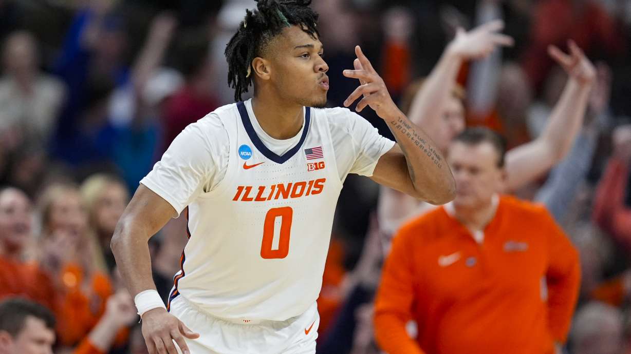 Illinois guard Terrence Shannon Jr. (0) celebrates after a three-point basket against Duquesne in the second half of a second-round college basketball game in the NCAA Tournament, Saturday, March 23, 2024, in Omaha, Neb.