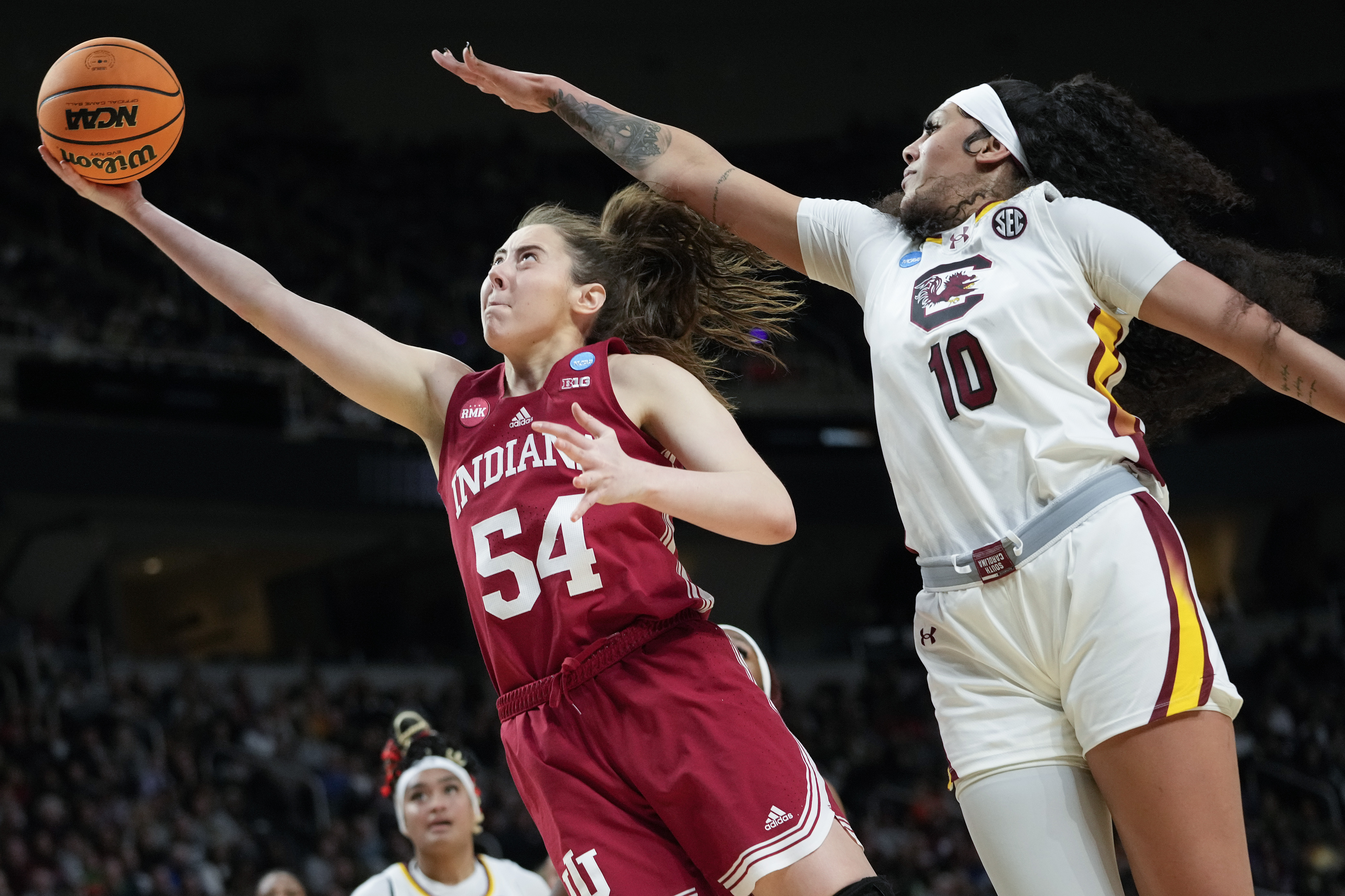 Indiana forward Mackenzie Holmes (54) puts up a shot against South Carolina center Kamilla Cardoso (10) during the second half of a Sweet Sixteen round college basketball game during the NCAA Tournament, Friday, March 29, 2024, in Albany, N.Y. 