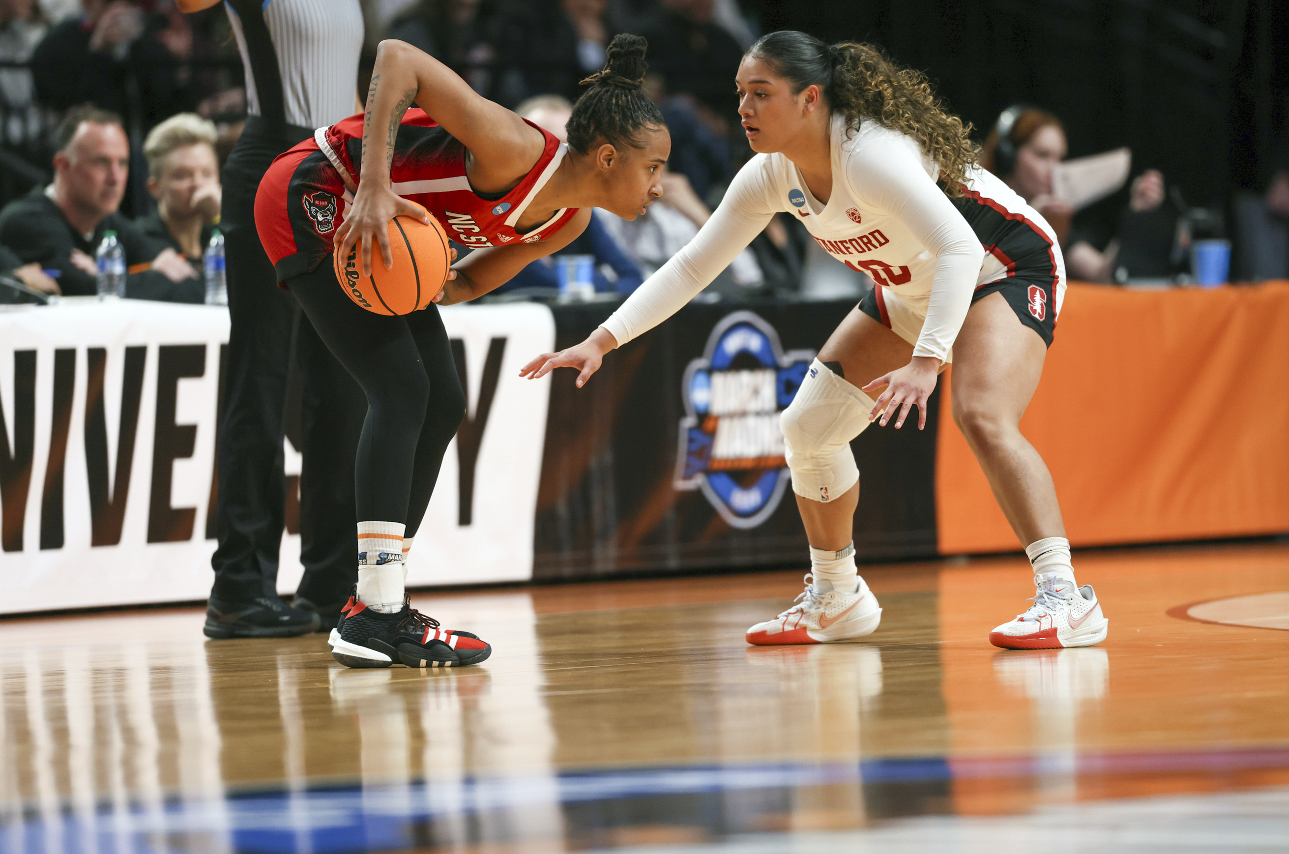 North Carolina State guard Aziaha James, left, looks to get around the defense of Stanford guard Talana Lepolo during the first half of a Sweet 16 college basketball game in the women's NCAA Tournament, Friday, March 29, 2024, in Portland, Ore. 
