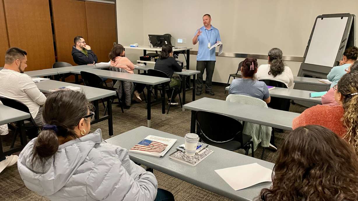 Bobby Workman teaches a U.S. citizenship class to a contingent of immigrants seeking citizenship at the Main Library in Ogden on Wednesday.