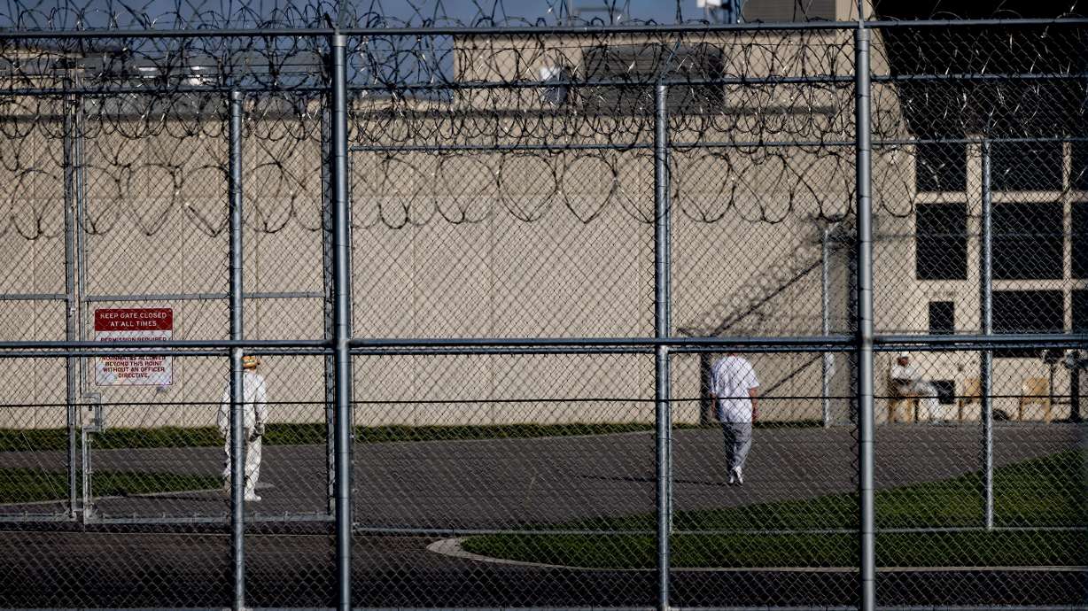 A man serving a life sentence in prison for shooting and killing another man when he was 17 in a dispute over an iPod had his first parole hearing on Tuesday.