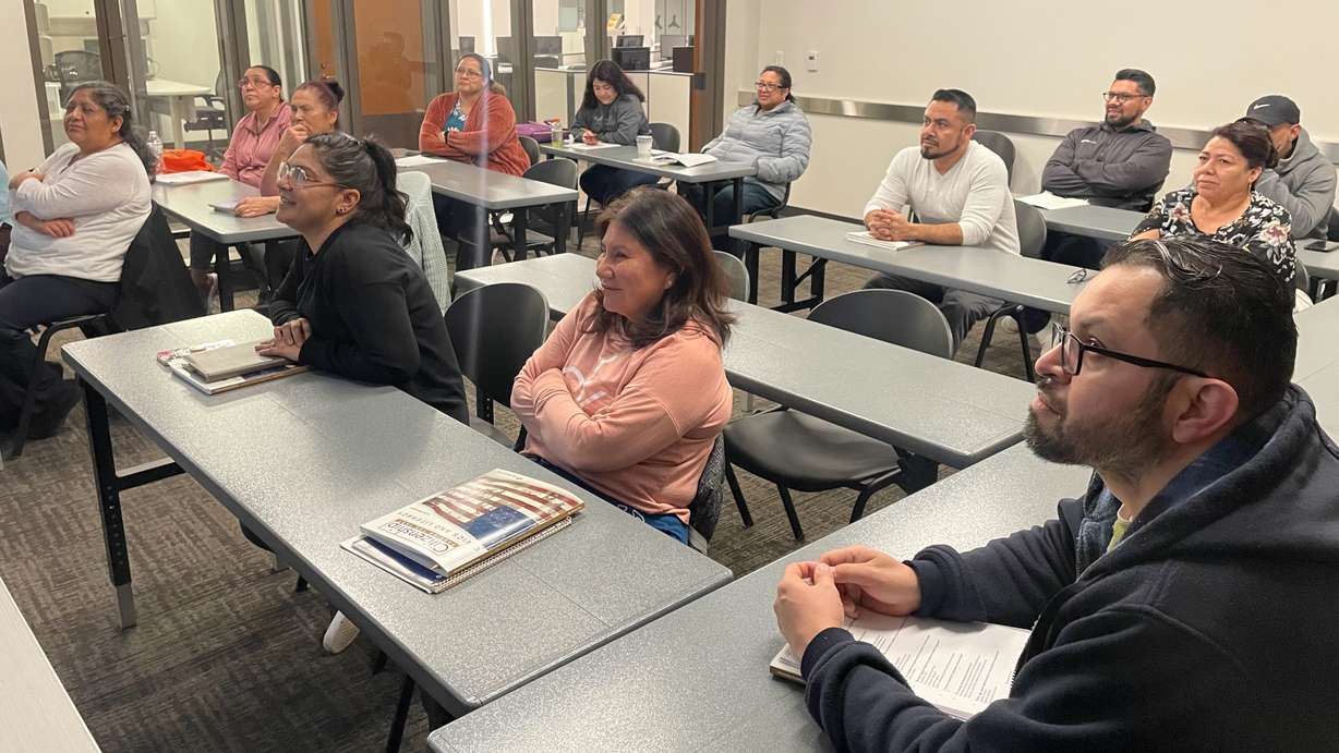 Students in a U.S. citizenship class listen to instructor Bobby Workman, not pictured, at the Main Library in Ogden on Wednesday.
