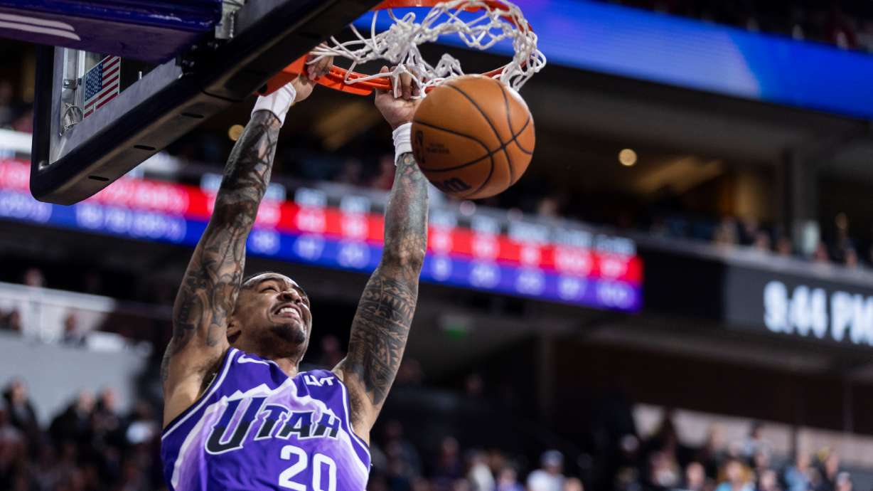 Utah Jazz forward John Collins (20) dunks the ball during a game against the Houston Rockets at the Delta Center in Salt Lake City on Friday, Mar 29, 2024.