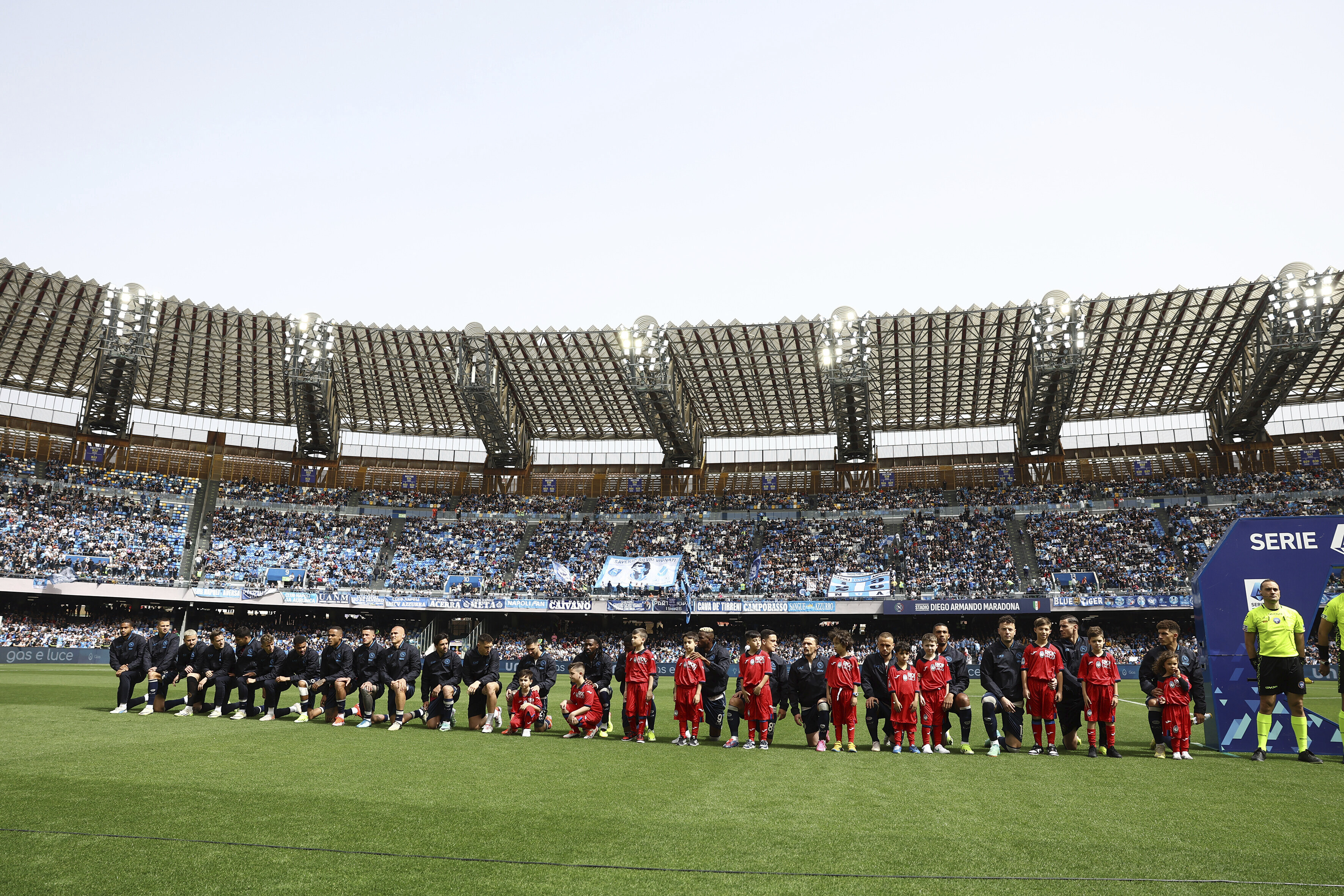 Napoli team players take the knee ahead of the Serie A soccer match between Napoli and Atalanta at the Diego Armando Maradona Stadium in Naples, Italy, Saturday, March 30, 2024. Napoli defender Juan Jesus says he has been left feeling “very bitter” and “crestfallen” by the Italian league’s decision not to punish Inter Milan player Francesco Acerbi for an allegedly racist remark toward him. 