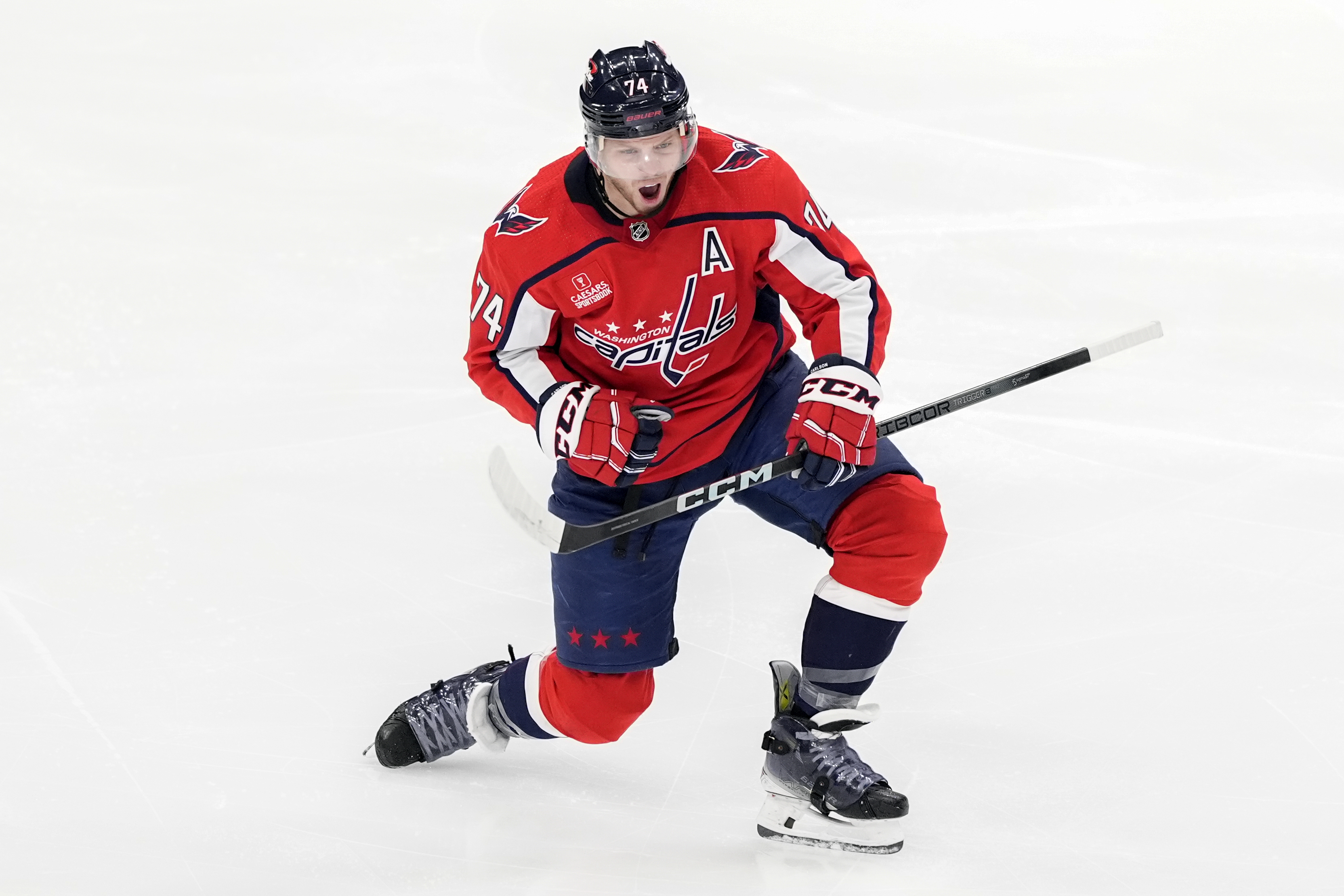 Washington Capitals defenseman John Carlson celebrates after scoring in the third period of an NHL hockey game against the Winnipeg Jets, Sunday, March 24, 2024, in Washington. 