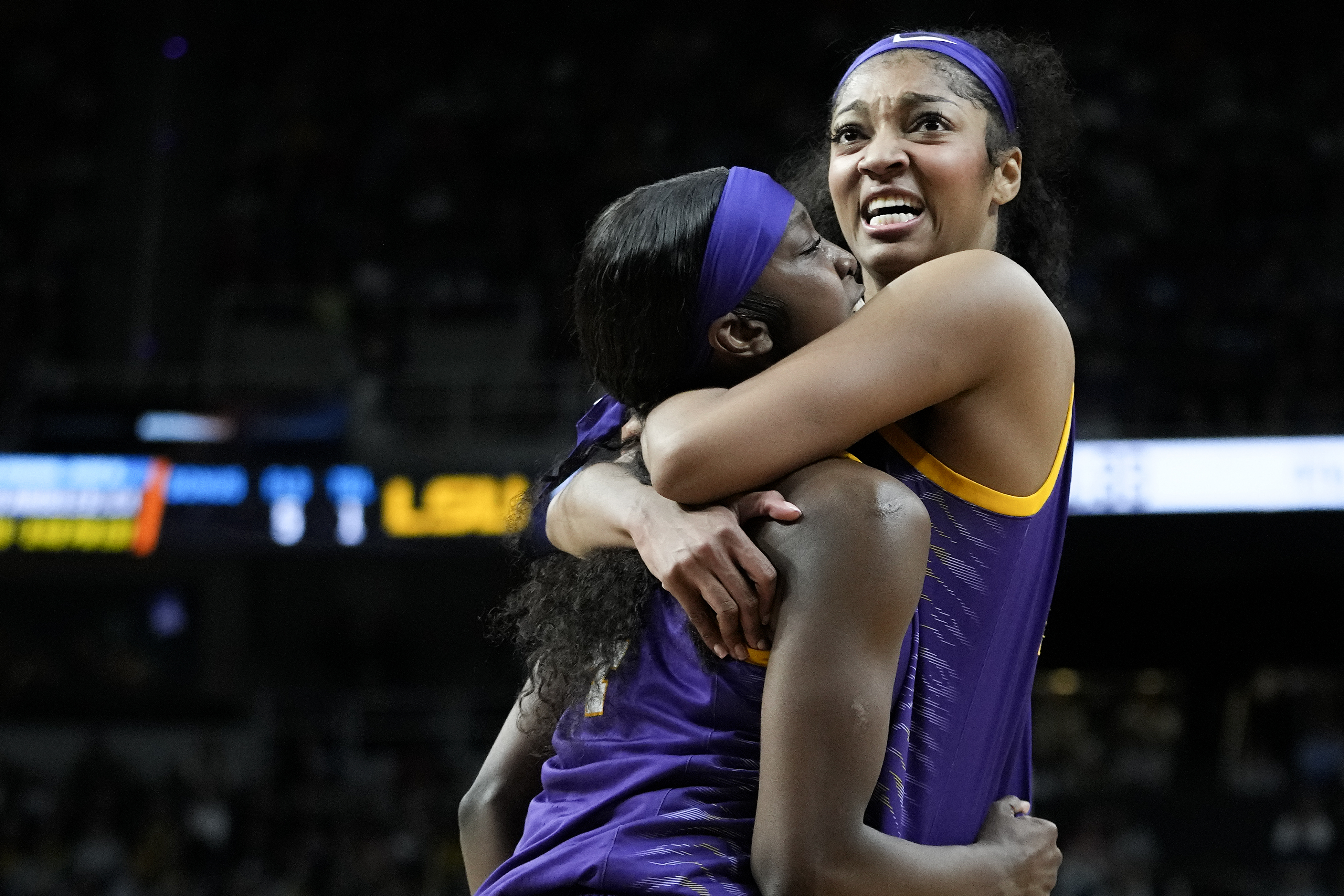 LSU guard Flau'jae Johnson (4) and LSU forward Angel Reese (10) react during the fourth quarter of a Sweet Sixteen round college basketball game against UCLA during the NCAA Tournament, Saturday, March 30, 2024, in Albany, N.Y.