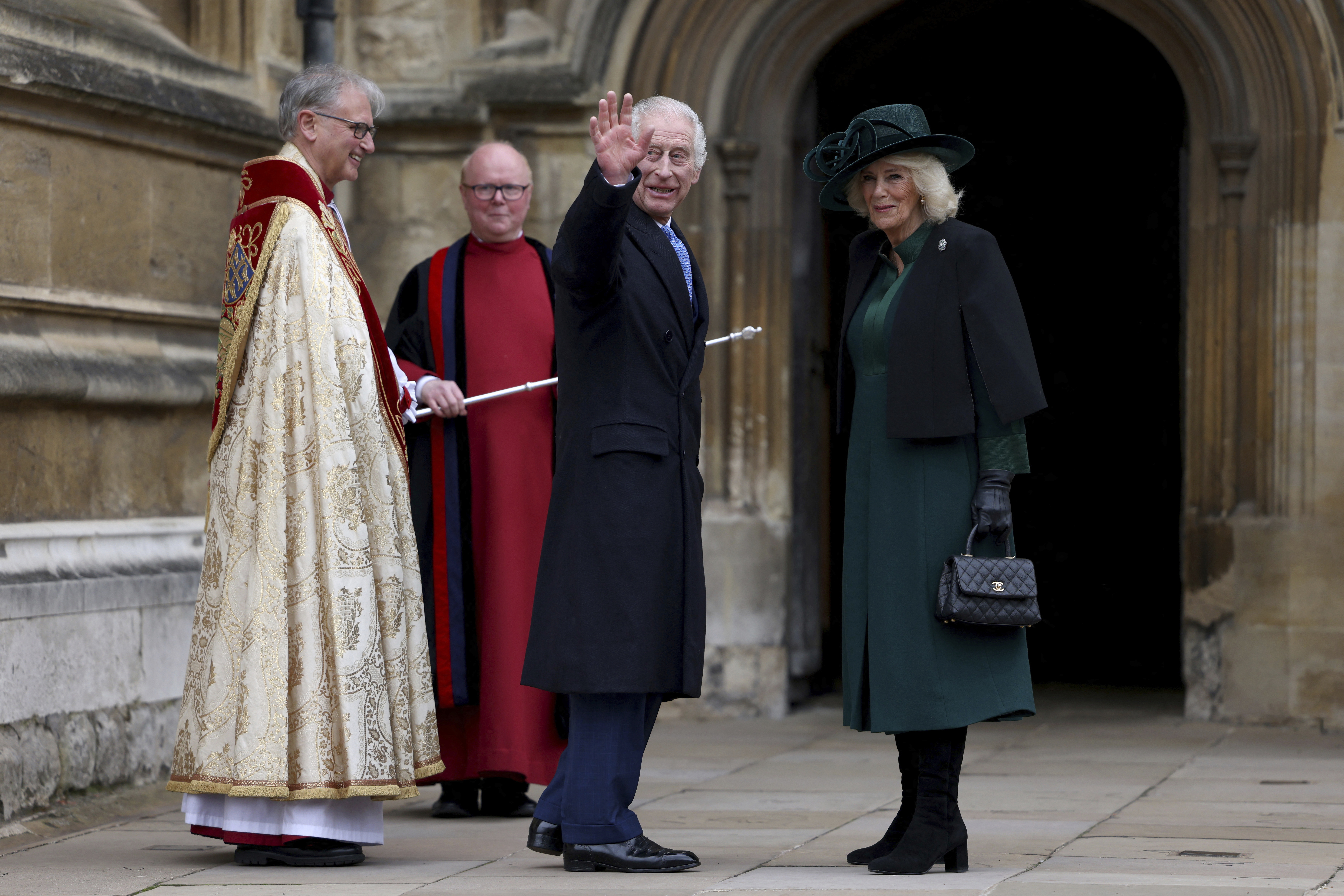 Britain's King Charles III, center, and Queen Camilla arrive to attend the Easter Matins Service at St. George's Chapel, Windsor Castle, England, Sunday. 