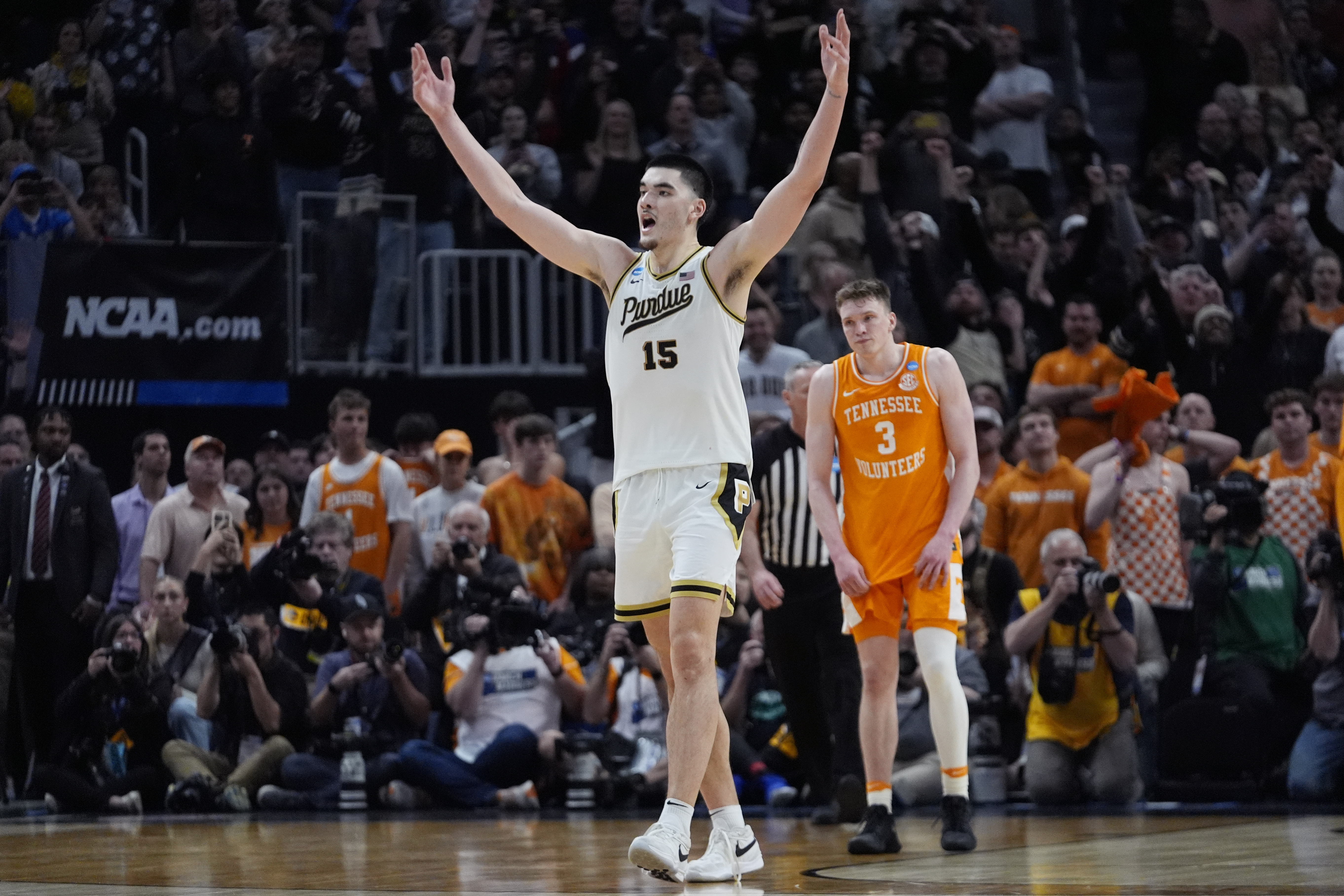 Purdue center Zach Edey (15) reacts near Tennessee guard Dalton Knecht (3) after the team defeated Tennessee in an Elite Eight college basketball game in the NCAA Tournament, Sunday, March 31, 2024, in Detroit. 