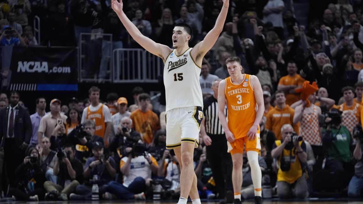 Purdue center Zach Edey (15) reacts near Tennessee guard Dalton Knecht (3) after the team defeated Tennessee in an Elite Eight college basketball game in the NCAA Tournament, Sunday, March 31, 2024, in Detroit.