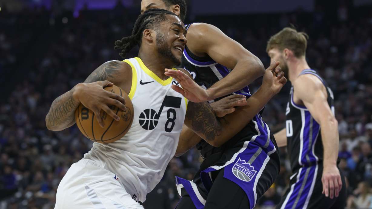 Utah Jazz forward Brice Sensabaugh (8) drives past Sacramento Kings forward Keegan Murray during the first half of an NBA basketball game in Sacramento, Calif., Sunday, March 31, 2024.