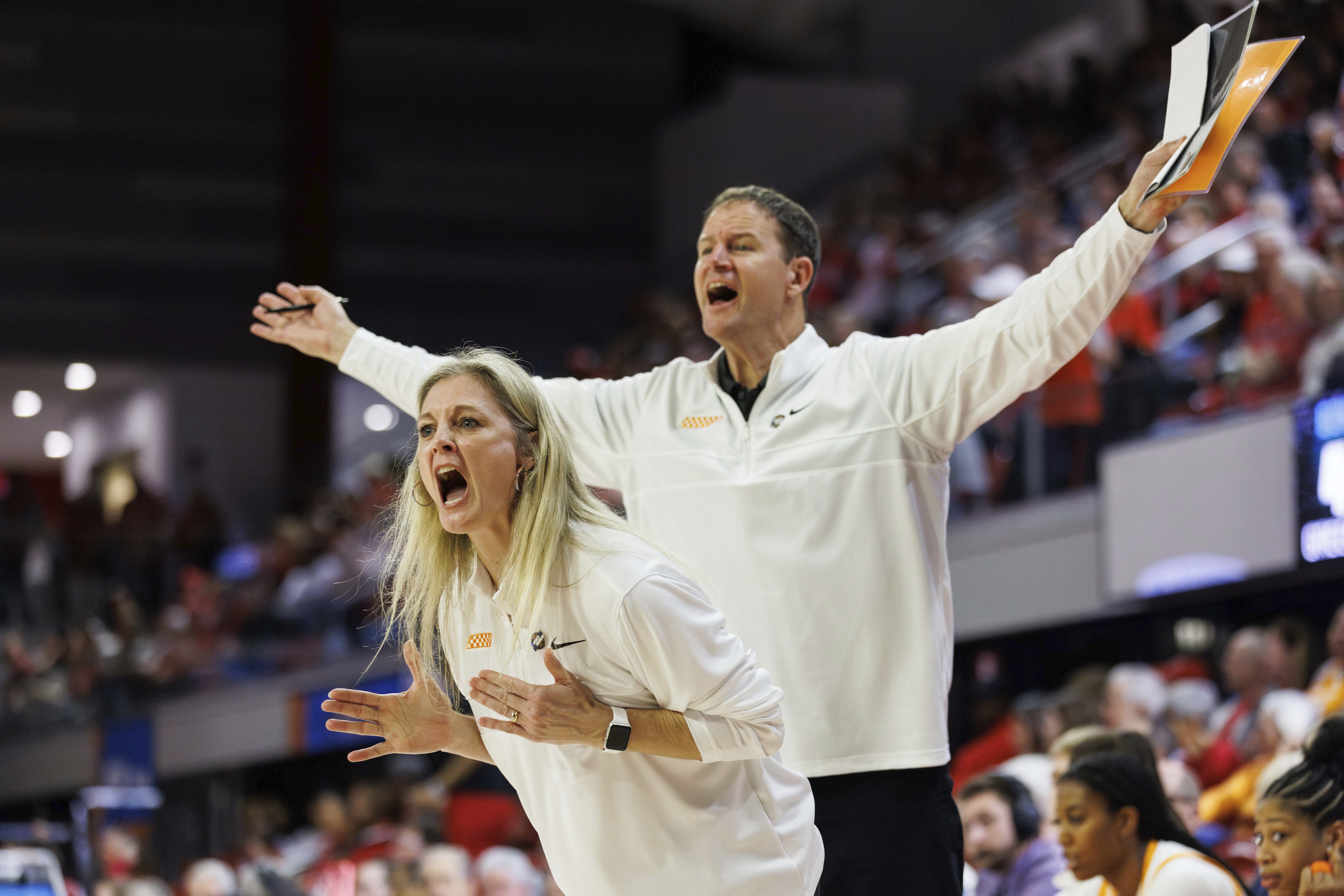 Tennessee head coach Kellie Harper, left, and assistant coach Joh Harper, right, shout towards the court during the second half of a first-round college basketball game against Green Bay in the NCAA Tournament in Raleigh, N.C., Saturday, March 23, 2024. 
