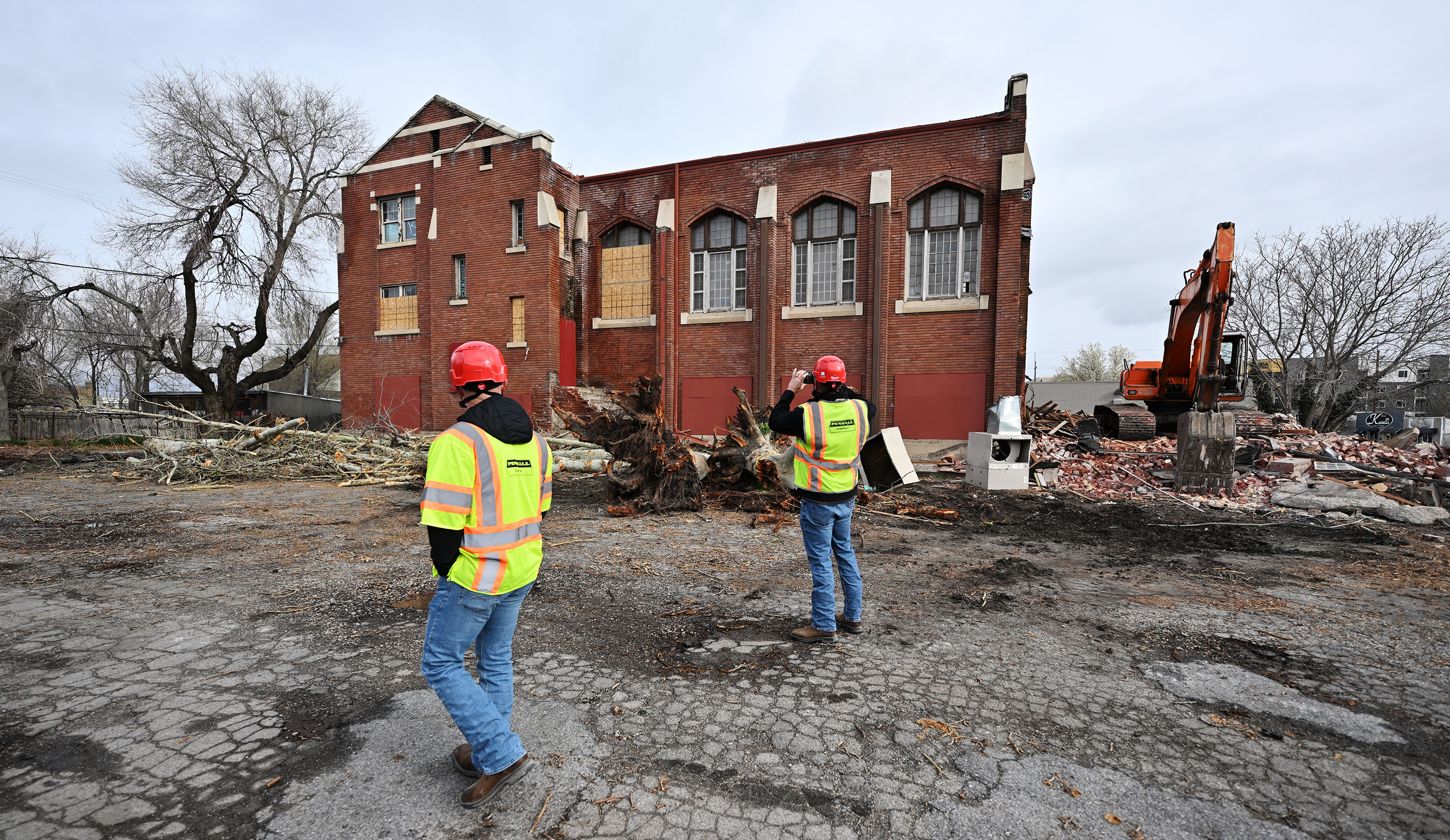 Employees of Penhall Company look at the property after demolition work occurring at 740 S. 300 West in Salt Lake City was halted due to lack of proper permitting, on Monday. The city is looking at changes to its preservation laws after the incident.
