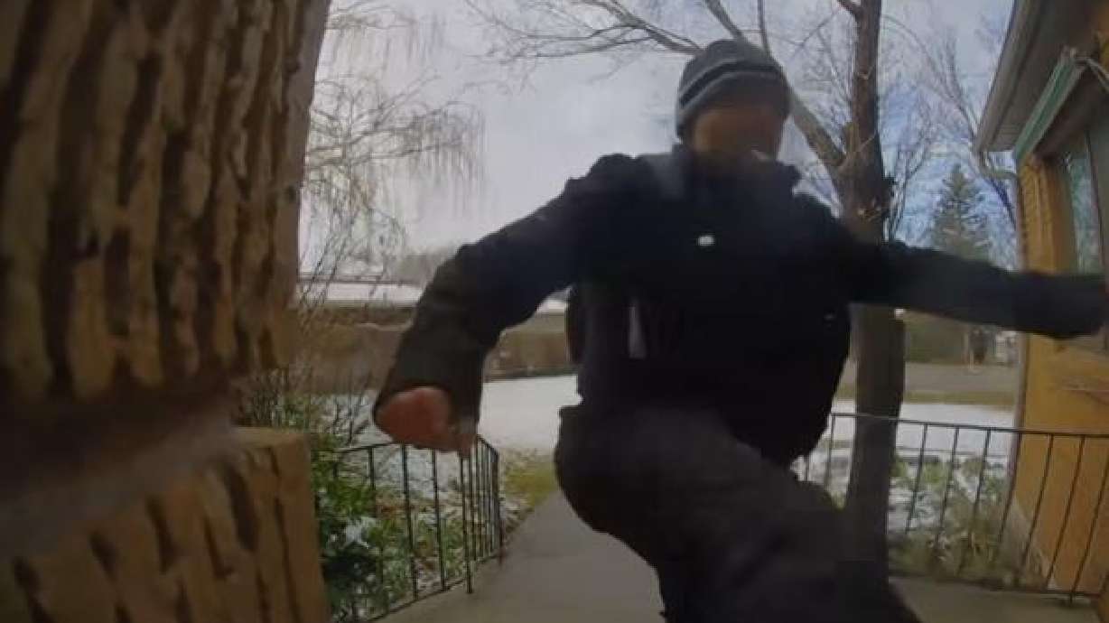 Police have arrested a Spanish Fork man who they say is pictured in this doorbell camera video kicking a door and breaking into a Millcreek home.