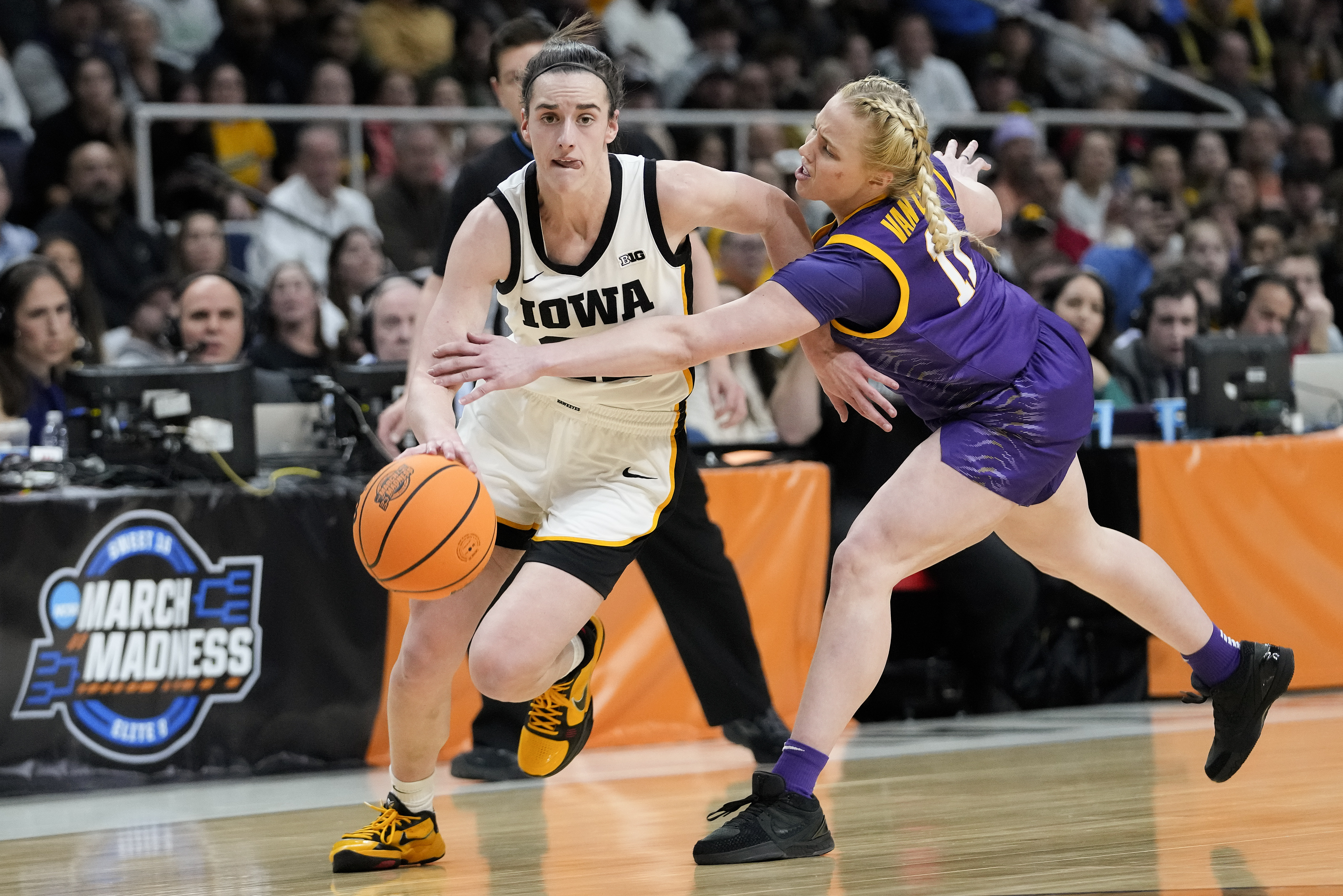 Iowa guard Caitlin Clark (22) drives against LSU guard Hailey Van Lith (11) during the first quarter of an Elite Eight round college basketball game during the NCAA Tournament, Monday, April 1, 2024, in Albany, N.Y. 