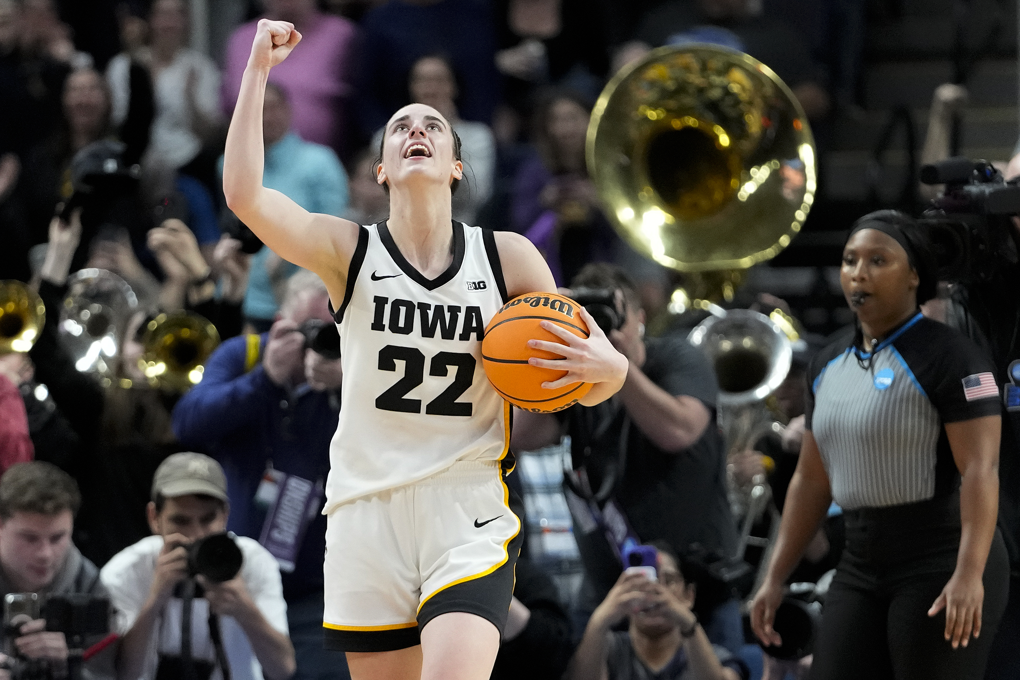 Iowa guard Caitlin Clark (22) celebrates after defeating LSU in an Elite Eight round college basketball game during the NCAA Tournament, Monday, April 1, 2024, in Albany, N.Y. 
