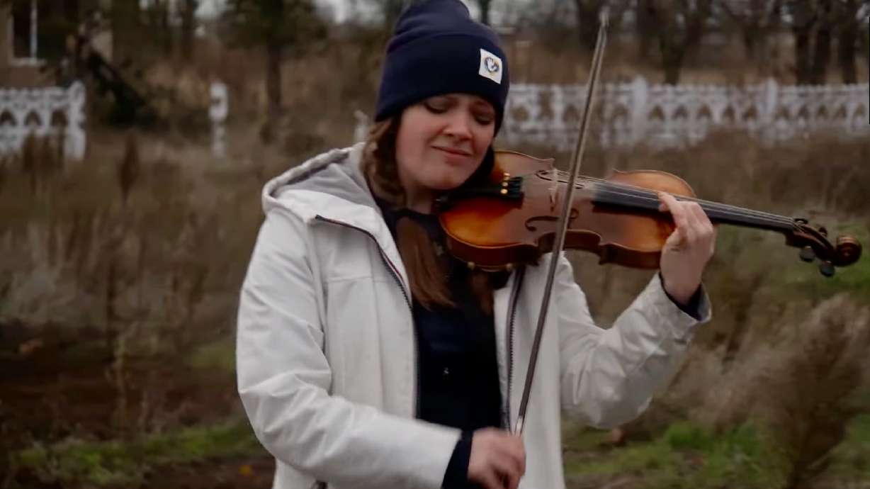 Lindsey Bohn, of Orem, is pictured playing her violin in the Kherson region of Ukraine in November 2023. She has actively raised funds to aid Ukraine in its war against Russia.