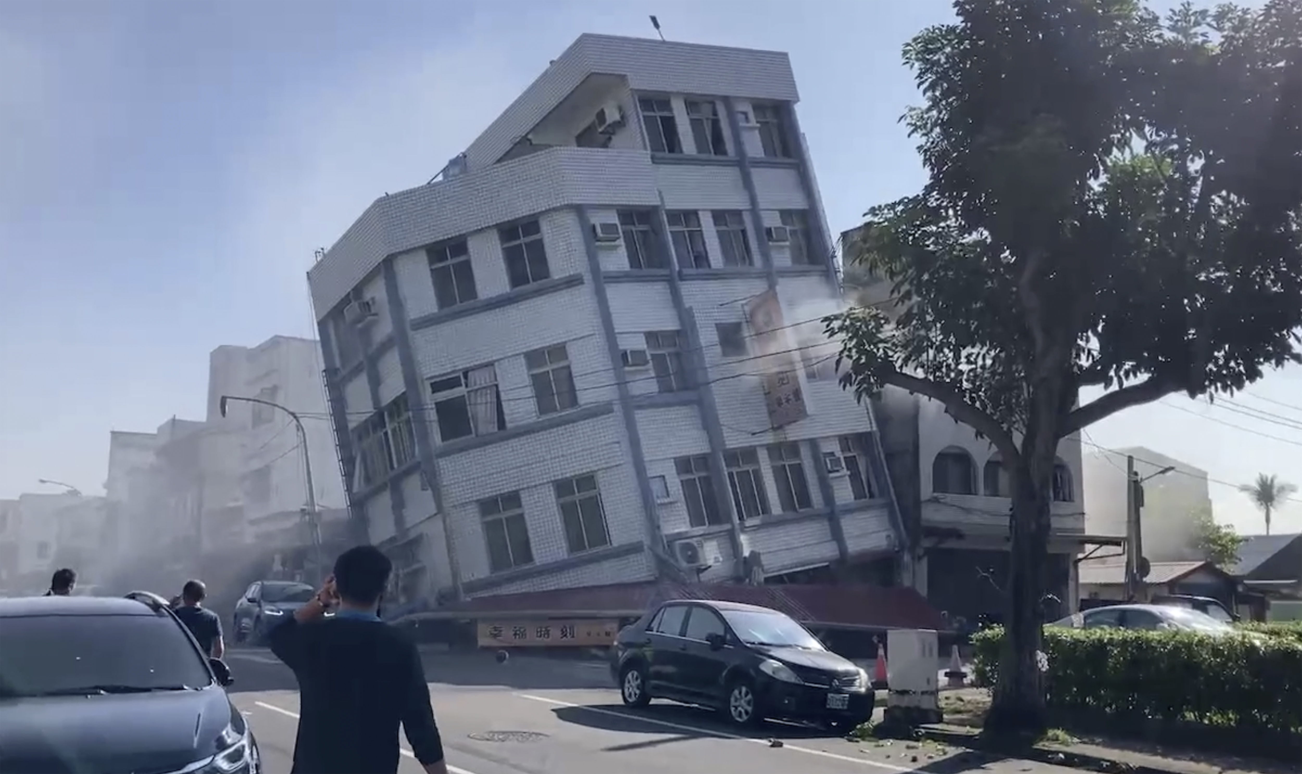 In this image taken from a video footage run by TVBS, a partially collapsed building is seen in Hualien, eastern Taiwan on Wednesday. A powerful earthquake rocked the entire island of Taiwan early Wednesday.