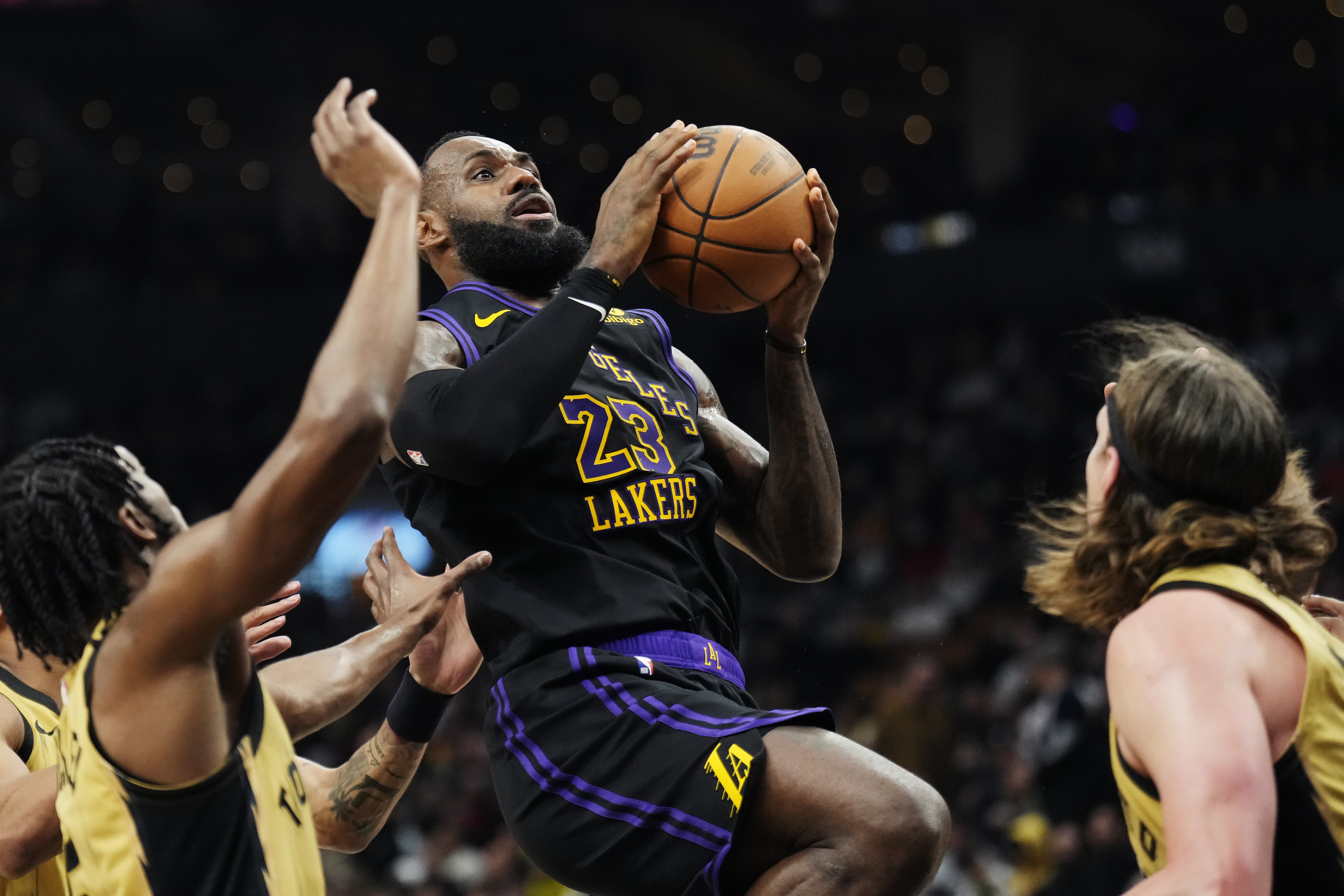 Los Angeles Lakers forward LeBron James (23) shoots against the Toronto Raptors during the second half of an NBA basketball game Tuesday, April 2, 2024, in Toronto. 
