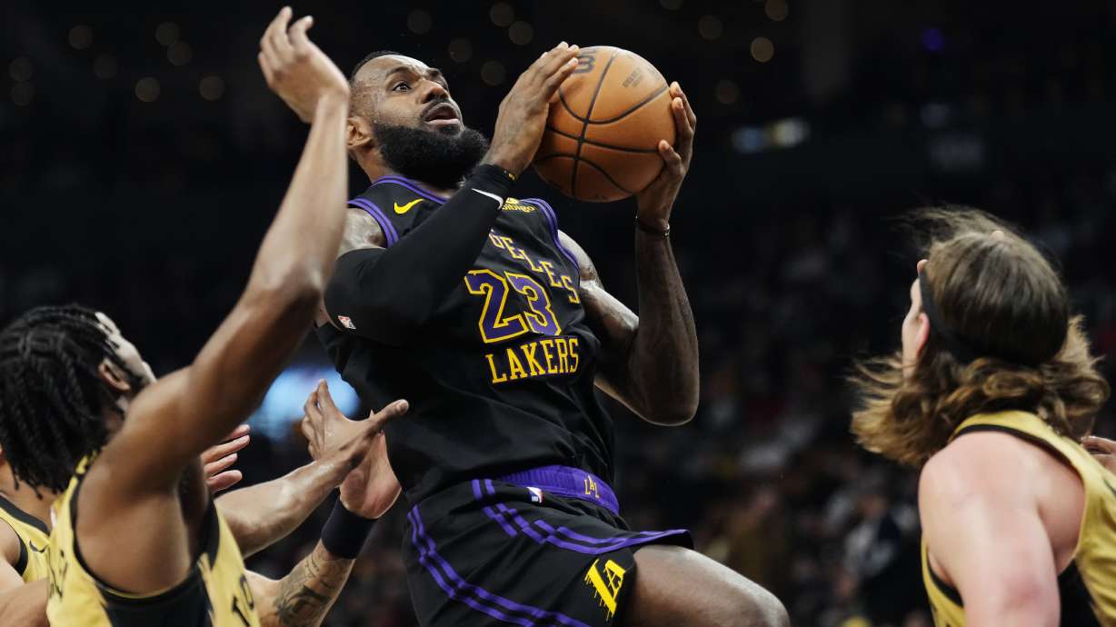 Los Angeles Lakers forward LeBron James (23) shoots against the Toronto Raptors during the second half of an NBA basketball game Tuesday, April 2, 2024, in Toronto.