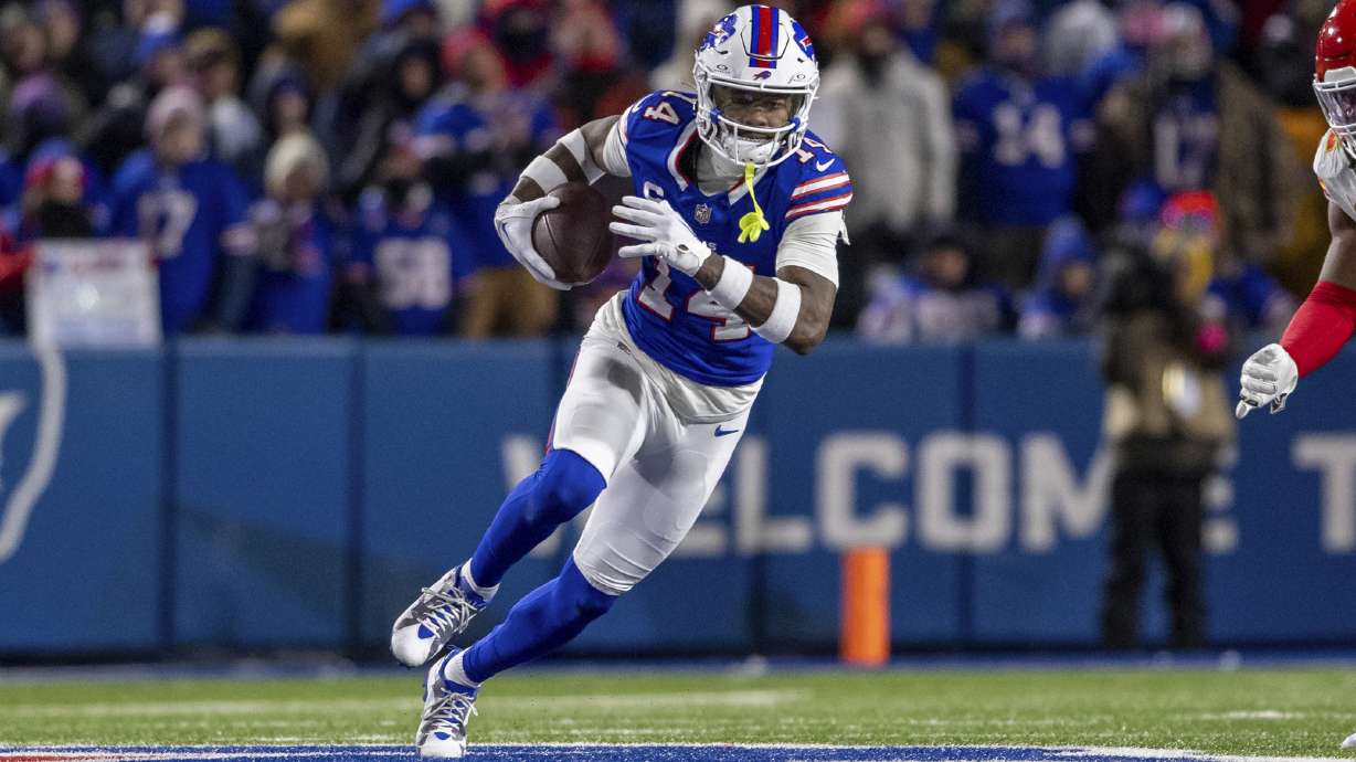 FILE - Buffalo Bills wide receiver Stefon Diggs (14) runs after a catch during an NFL divisional round playoff football game, Sunday, Jan. 21, 2024 in Orchard Park, N.Y. The Buffalo Bills are trading their top receiving threat, Stefon Diggs, to the Houston Texans in a deal that was agreed to on Wednesday, April 3, 2024, a person with knowledge of the discussions confirmed to The Associated Press.