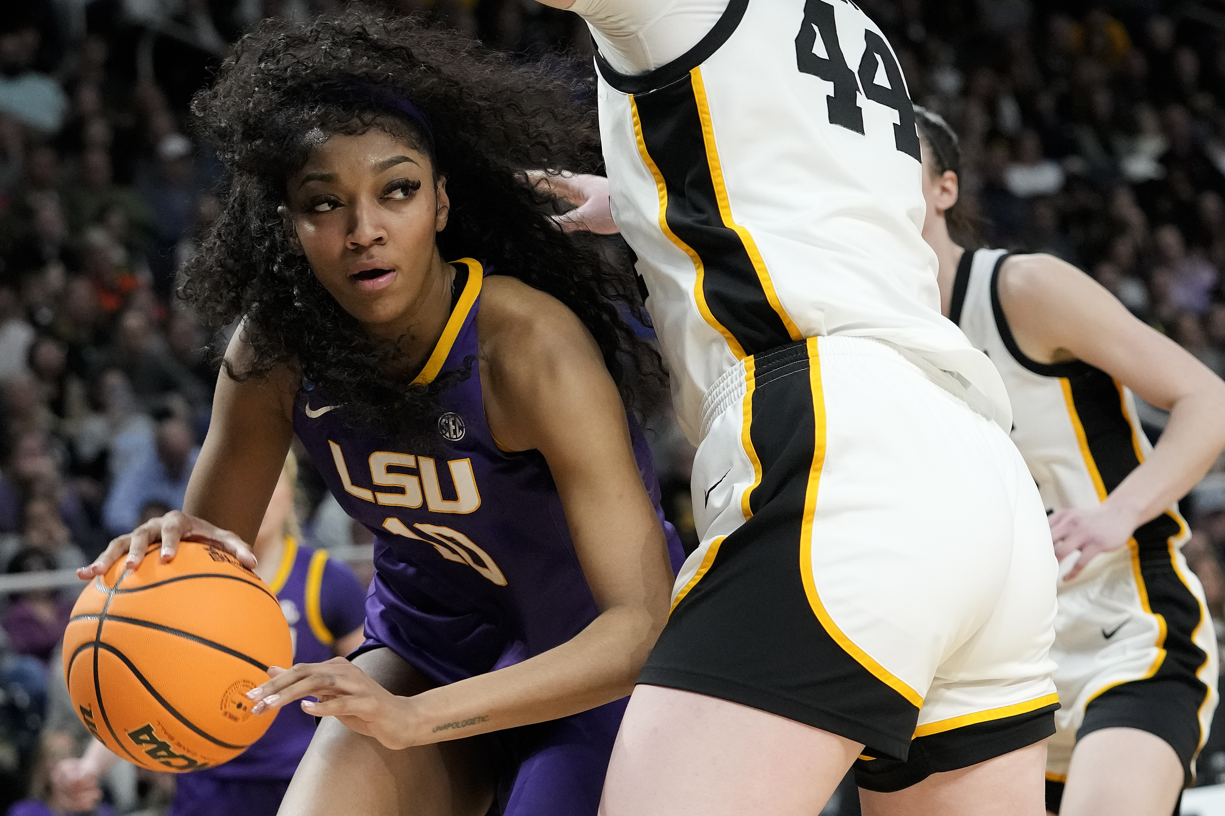 LSU forward Angel Reese (10) drives around Iowa forward Addison O'Grady (44) during the fourth quarter of an Elite Eight round college basketball game during the NCAA Tournament, Monday, April 1, 2024, in Albany, N.Y. 
