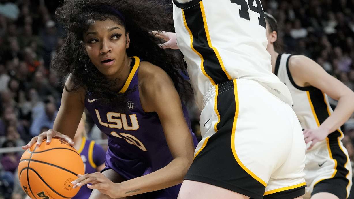 LSU forward Angel Reese (10) drives around Iowa forward Addison O'Grady (44) during the fourth quarter of an Elite Eight round college basketball game during the NCAA Tournament, Monday, April 1, 2024, in Albany, N.Y.