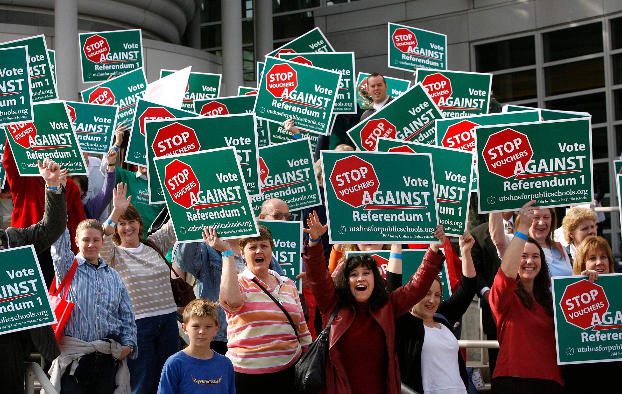Teachers show their support against Referendum 1 on the front steps of the Salt Palace during the UEA convention in Salt Lake City, Oct. 29, 2007. The teachers' union has come out against a proposed constitutional amendment.