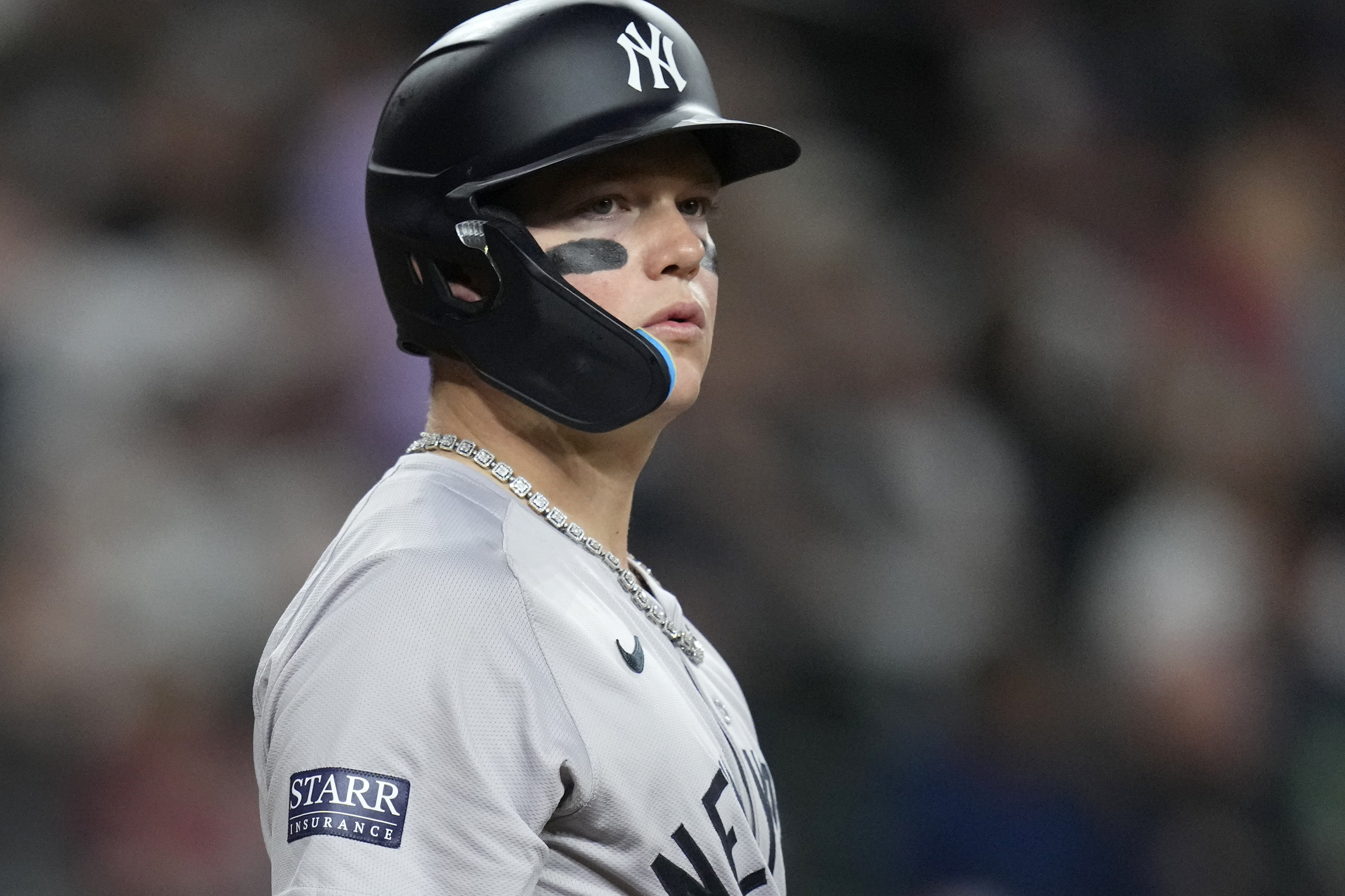 New York Yankees' Alex Verdugo pauses at home plate while batting during the seventh inning of a baseball game against the Arizona Diamondbacks Tuesday, April 2, 2024, in Phoenix. During his time with the Boston Red Sox, Alex Verdugo frequently played with several gaudy chains bouncing around his neck. He packs at least six for every road trip, and he's lost count of how many he owns. In his first season with the famously clean-cut New York Yankees, Verdugo has been given an order by manager Aaron Boone: only one chain per game. 