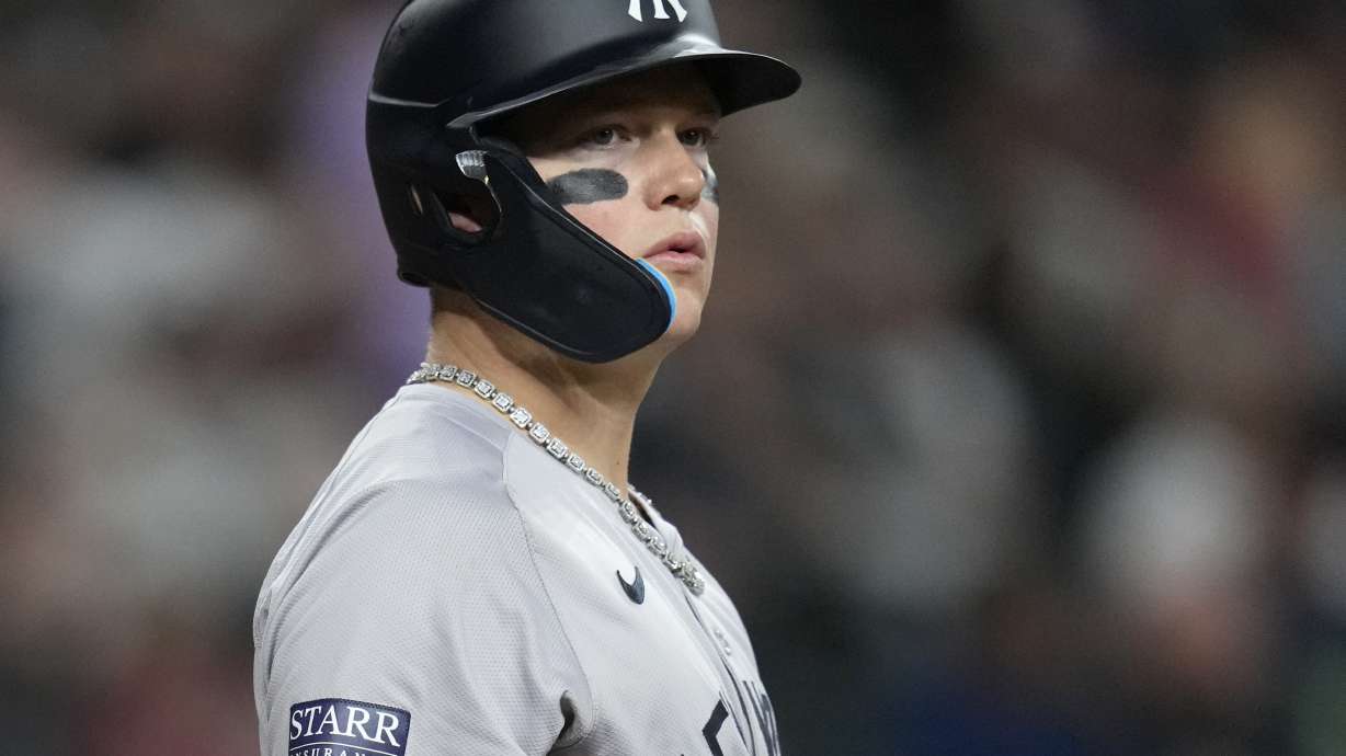 New York Yankees' Alex Verdugo pauses at home plate while batting during the seventh inning of a baseball game against the Arizona Diamondbacks Tuesday, April 2, 2024, in Phoenix. During his time with the Boston Red Sox, Alex Verdugo frequently played with several gaudy chains bouncing around his neck. He packs at least six for every road trip, and he's lost count of how many he owns. In his first season with the famously clean-cut New York Yankees, Verdugo has been given an order by manager Aaron Boone: only one chain per game.